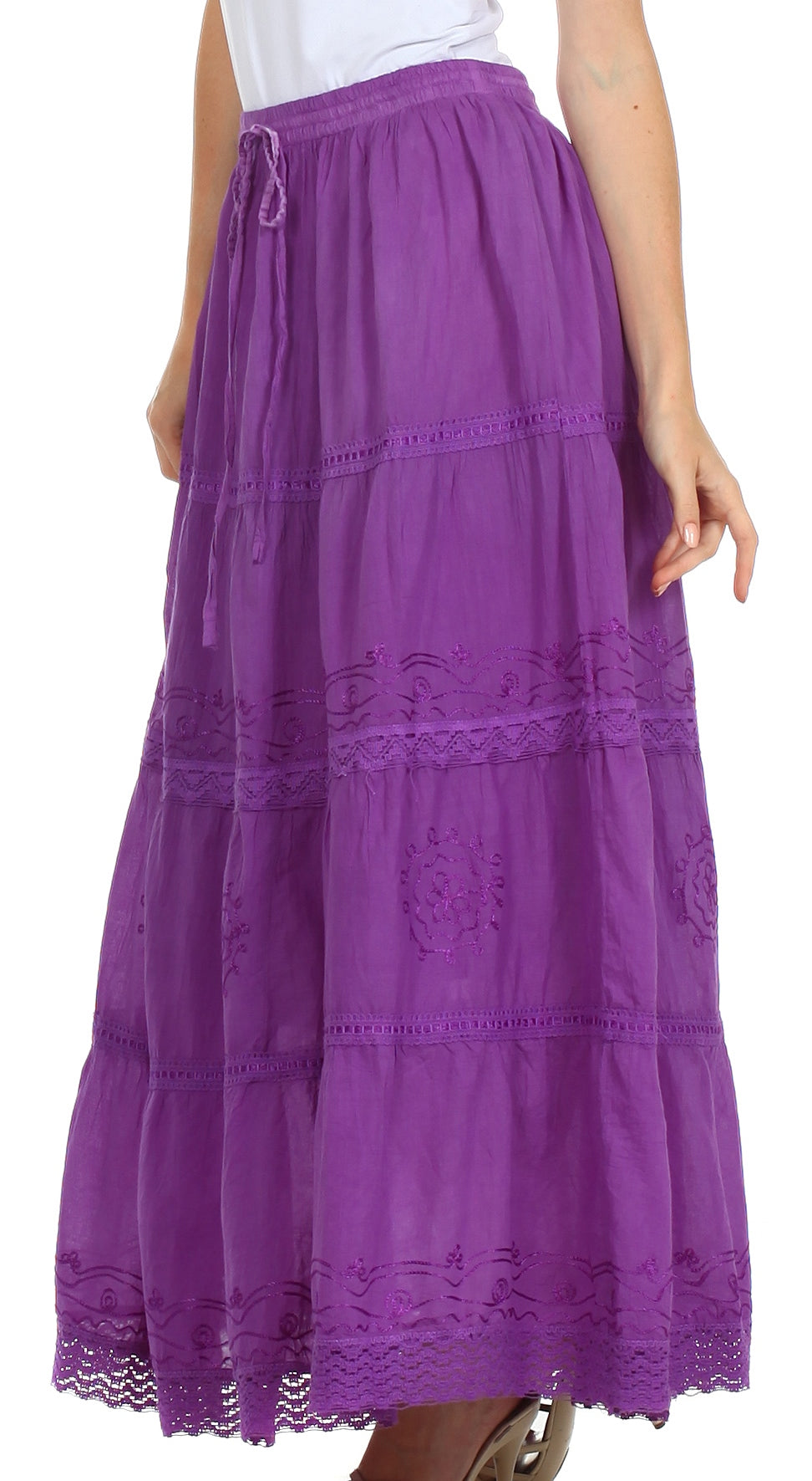 Purple lace-trimmed skirt worn by a person on a white background