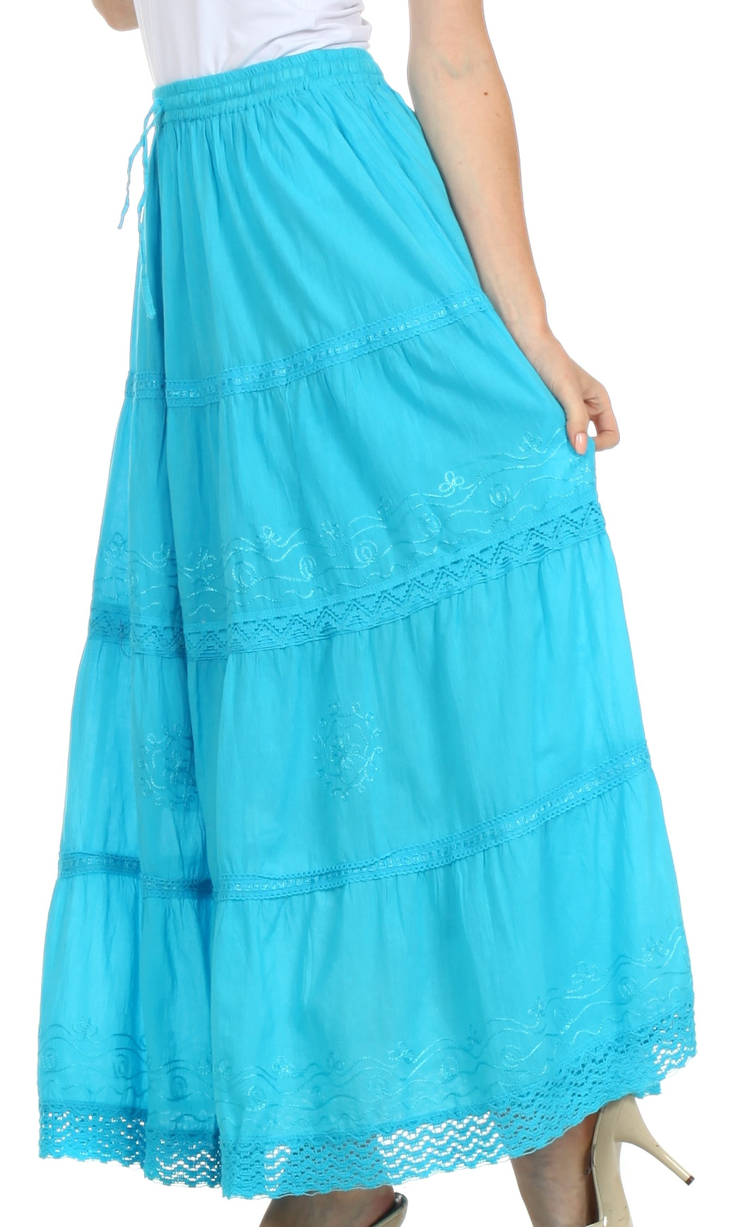 Turquoise skirt with lace details worn by a person on a white background