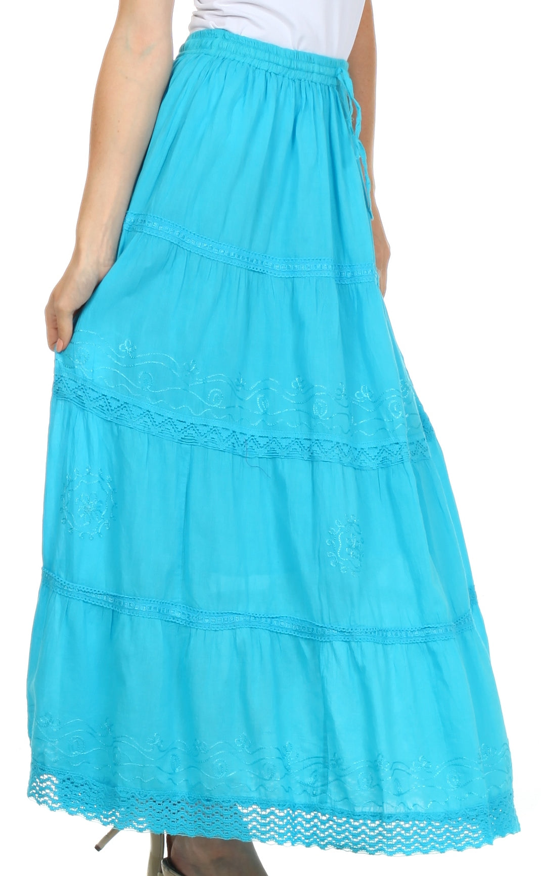 Turquoise tiered skirt worn by a person on a white background