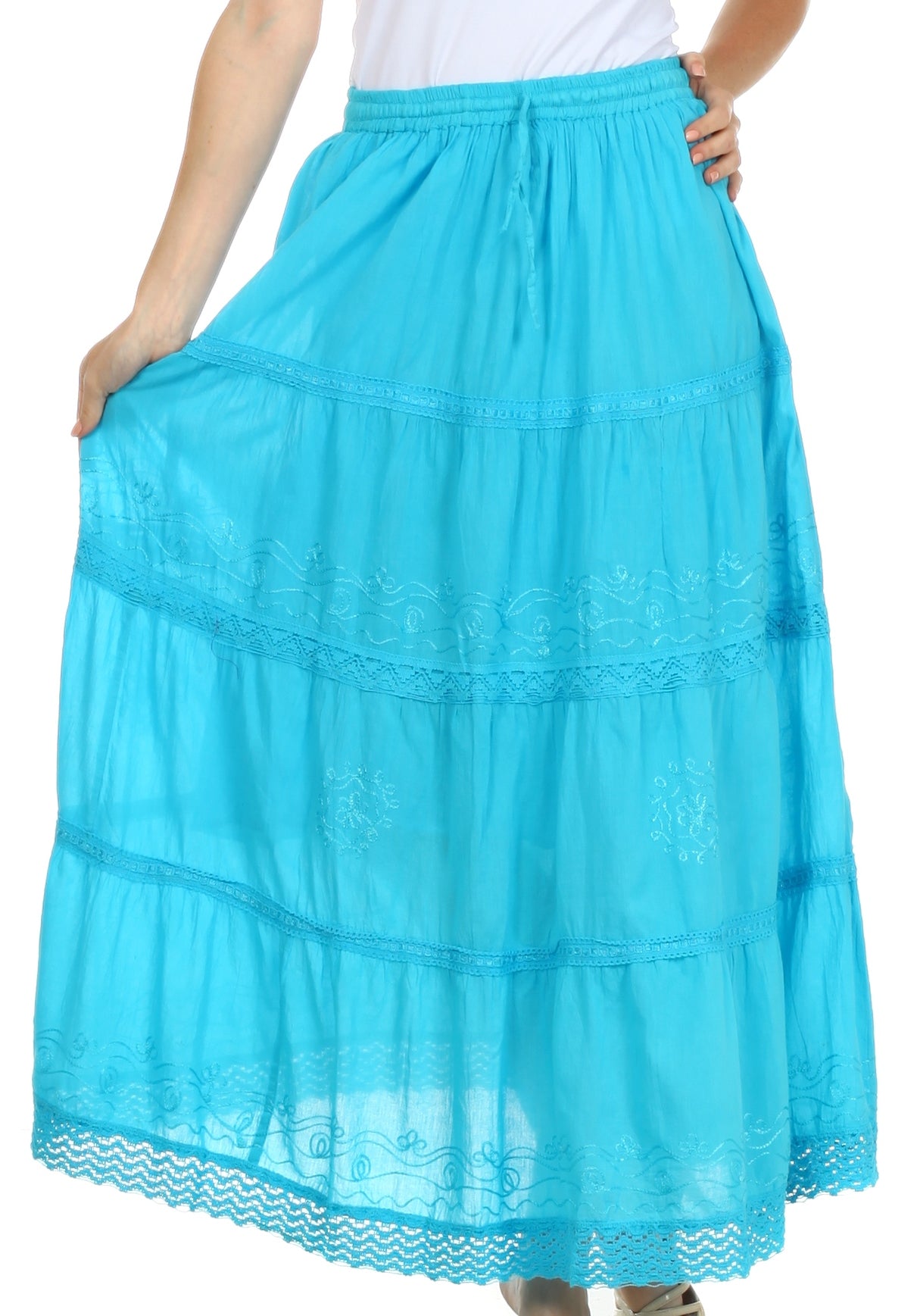 Turquoise tiered skirt worn by a person on a white background