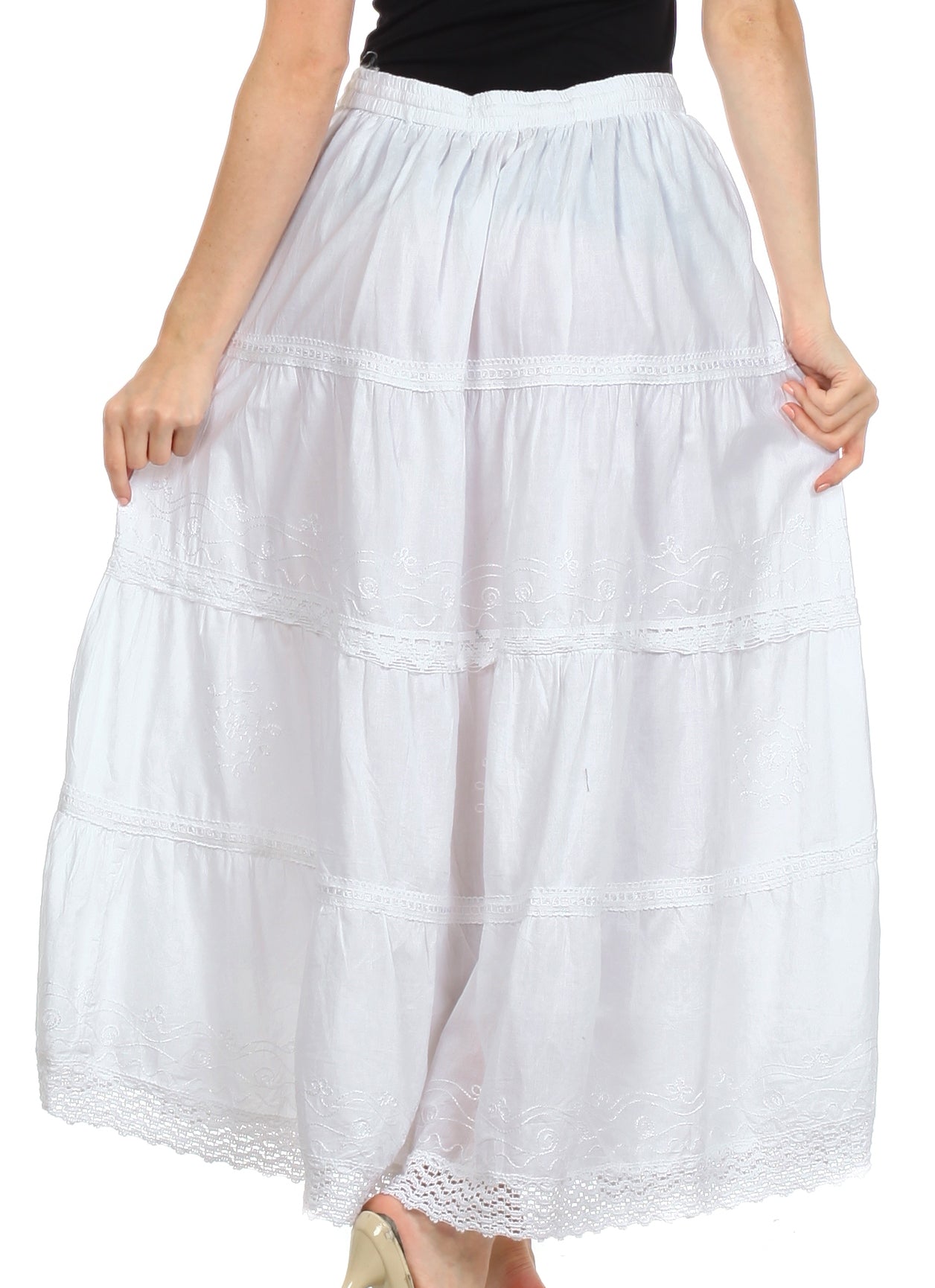 White tiered skirt worn by a person on a white background