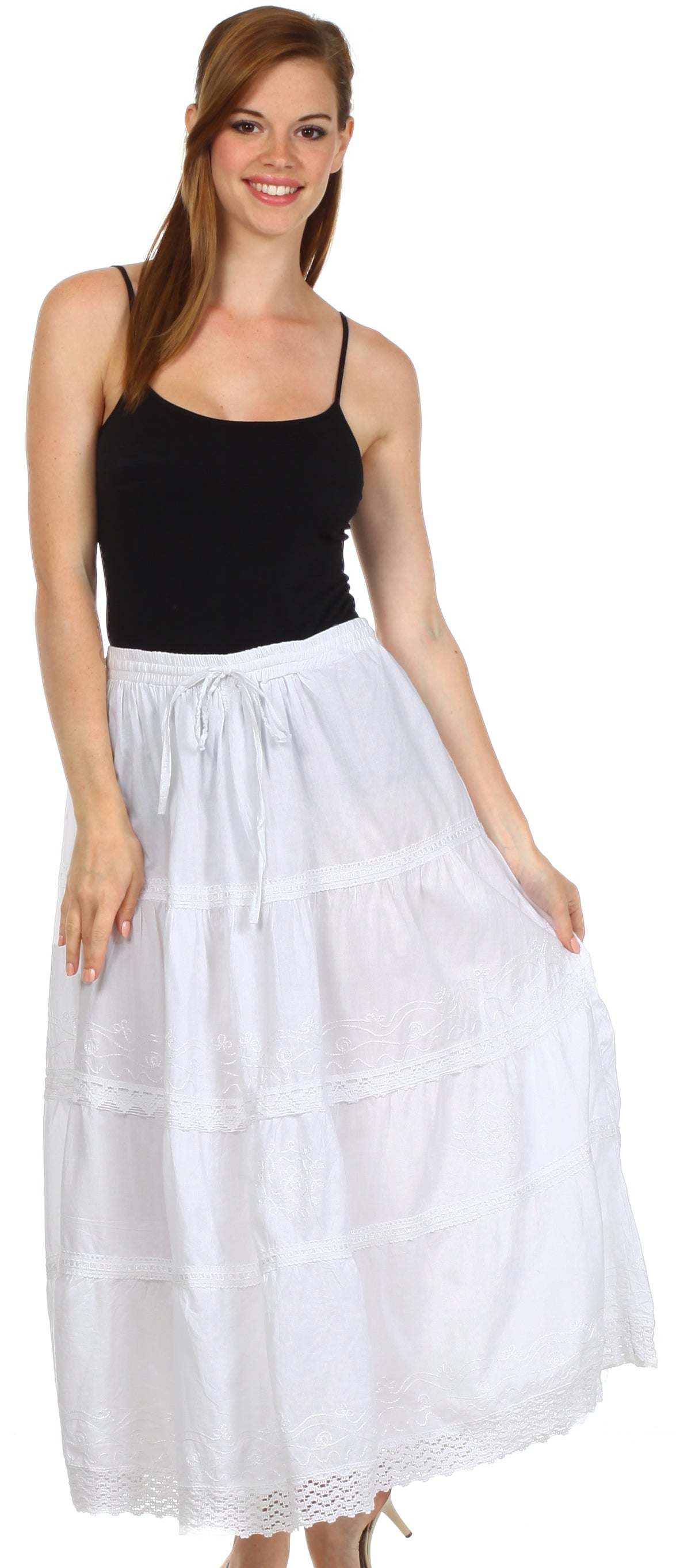 Woman wearing a black top and white skirt on a white background