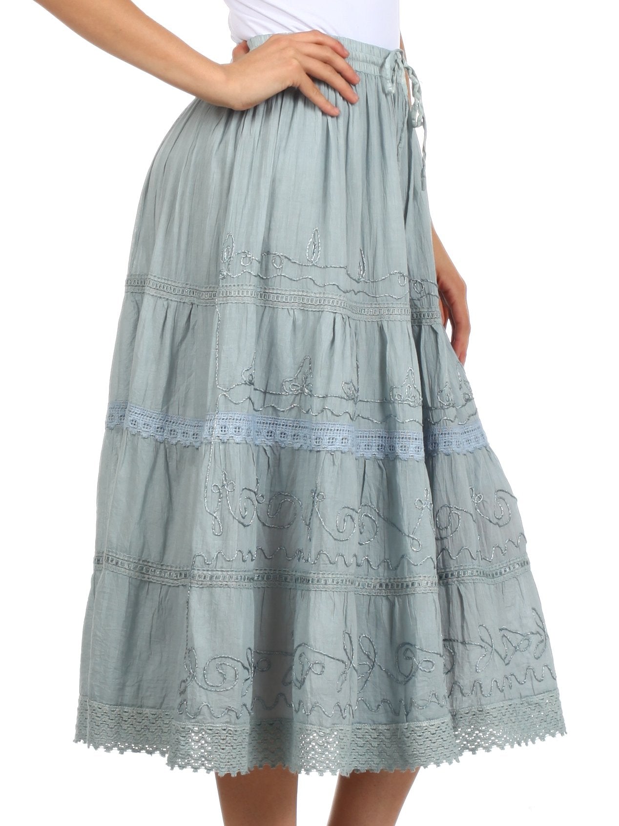 Light blue embroidered skirt on a white background