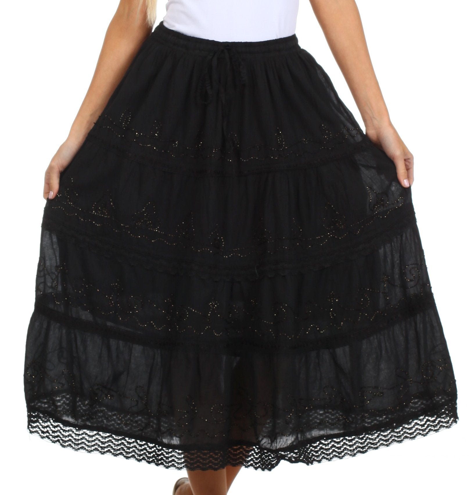 Black lace skirt worn by a person on a white background