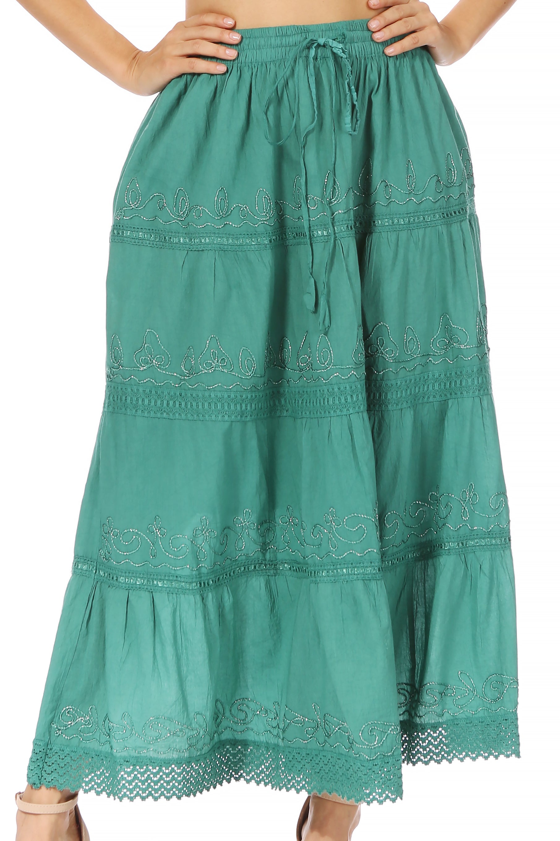 Green embroidered skirt with tiered design on a white background