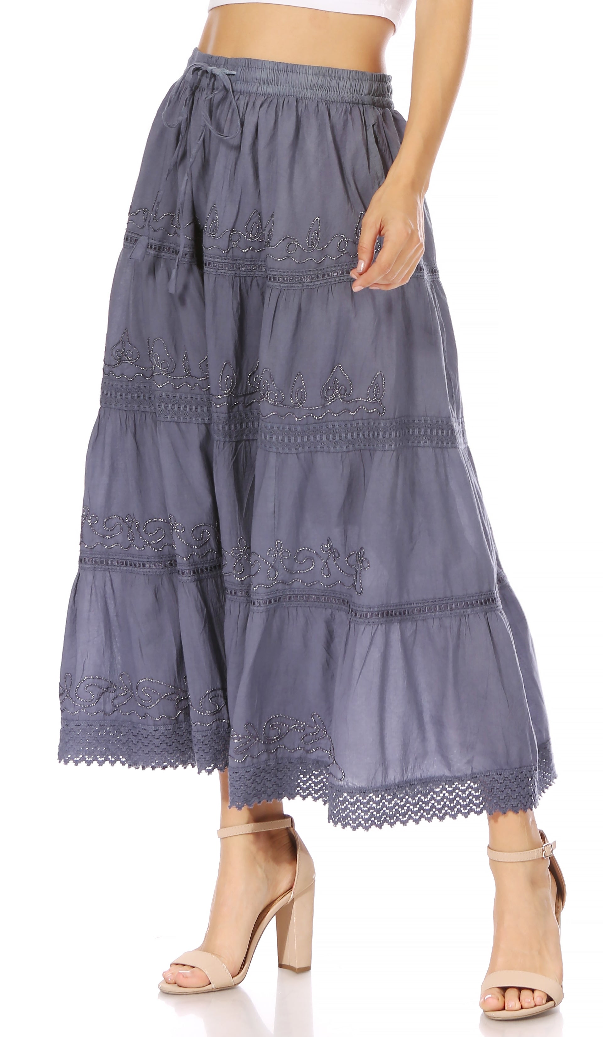 Long denim skirt with lace details worn by a person on a white background