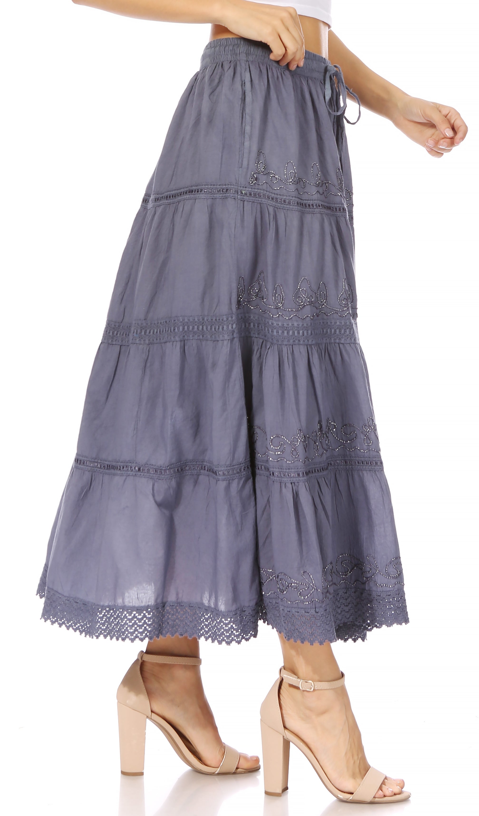 Long tiered skirt with lace details on a white background