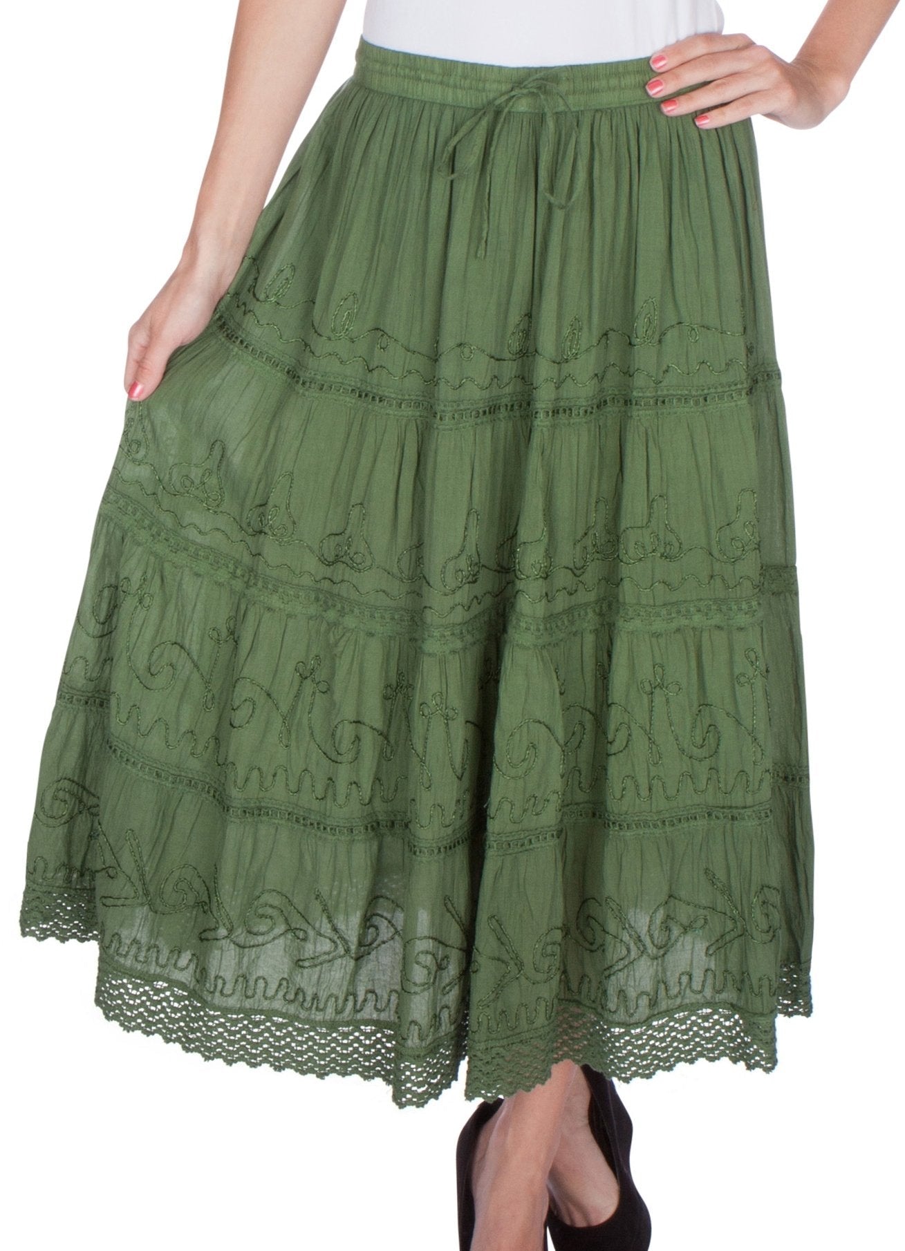 Green lace skirt worn by a person on a white background