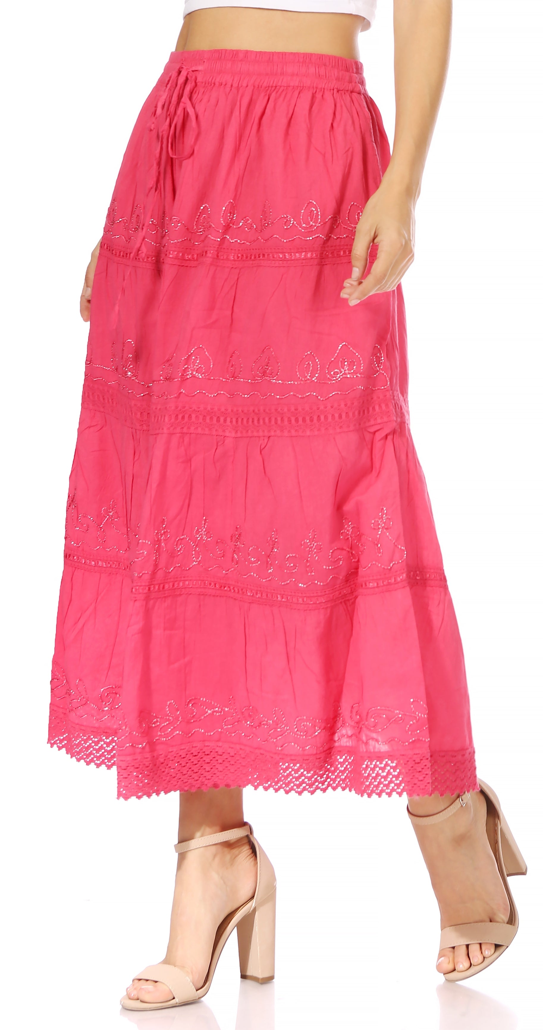 Pink embroidered skirt worn by a person on a white background