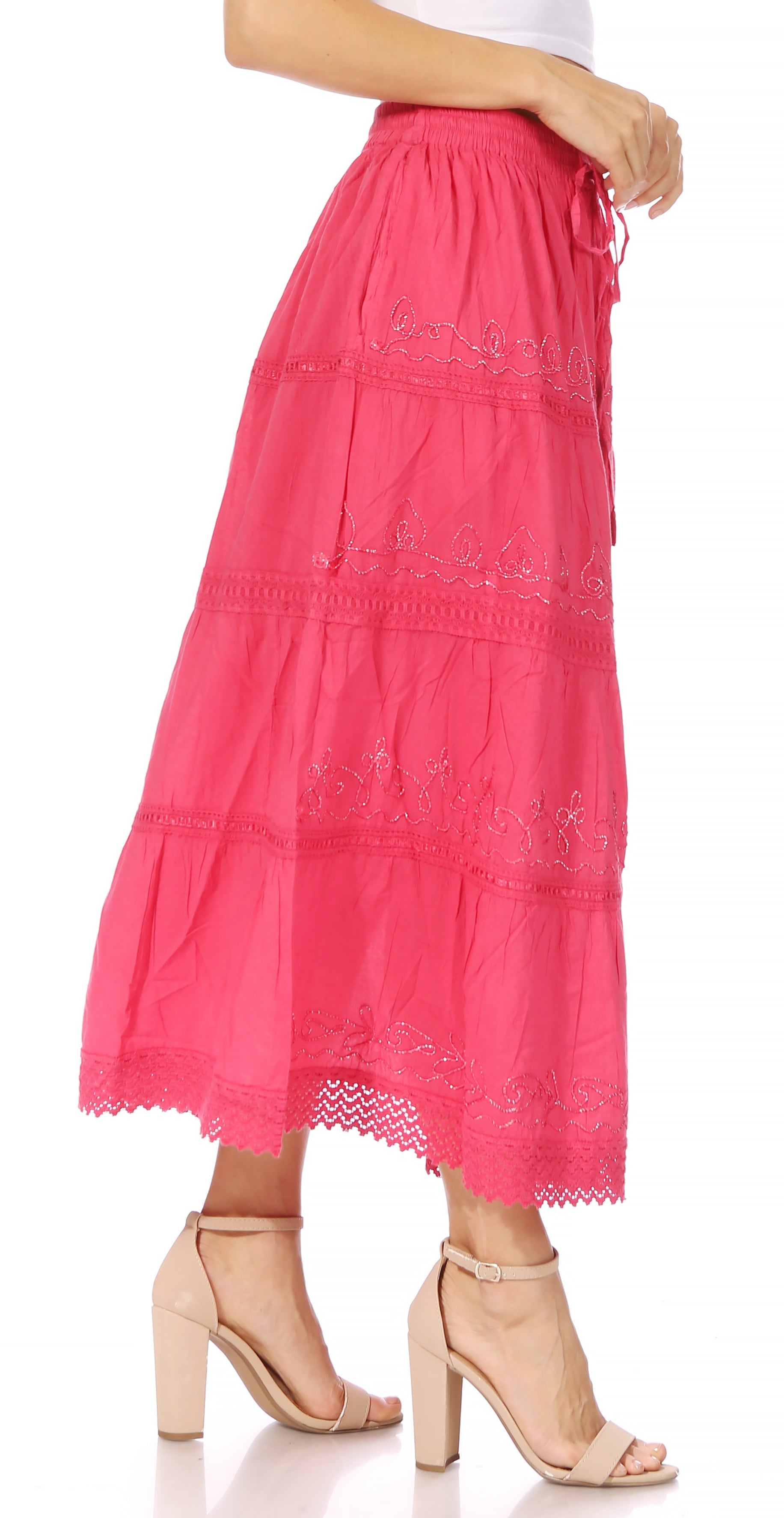 Pink lace skirt worn by a person on a white background