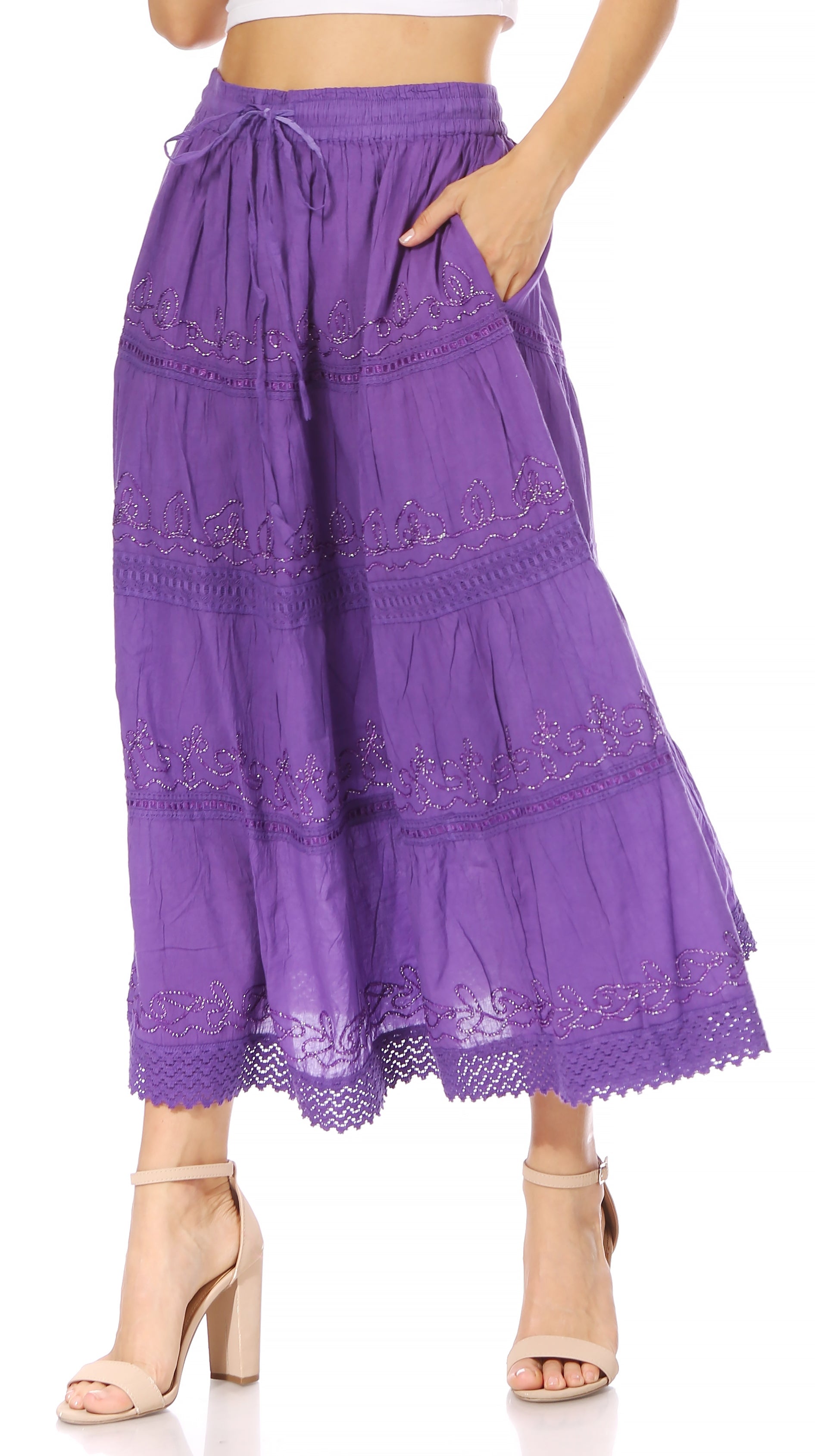 Purple lace skirt worn by a person on a white background