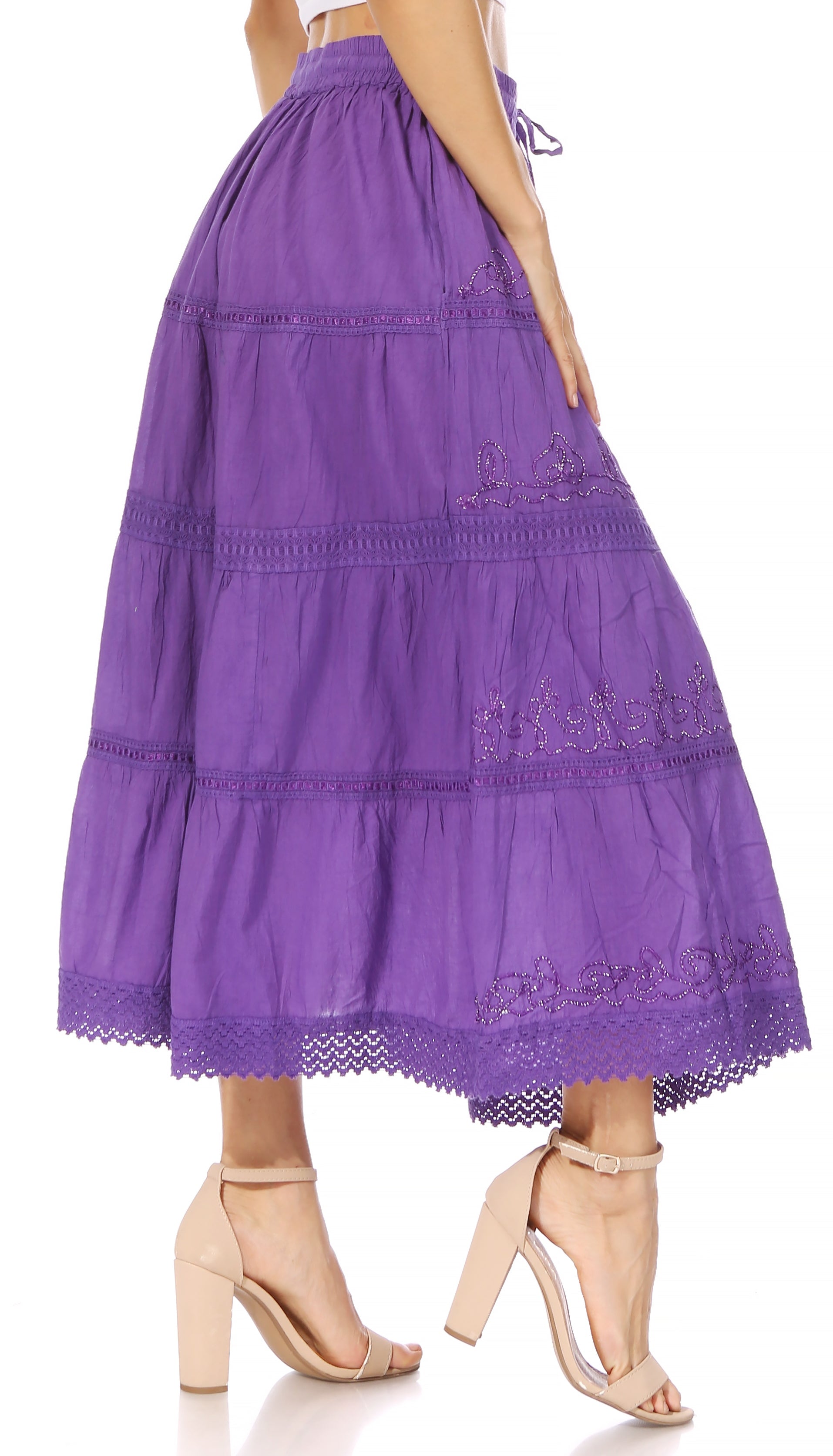 Purple tiered skirt worn by a person on a white background