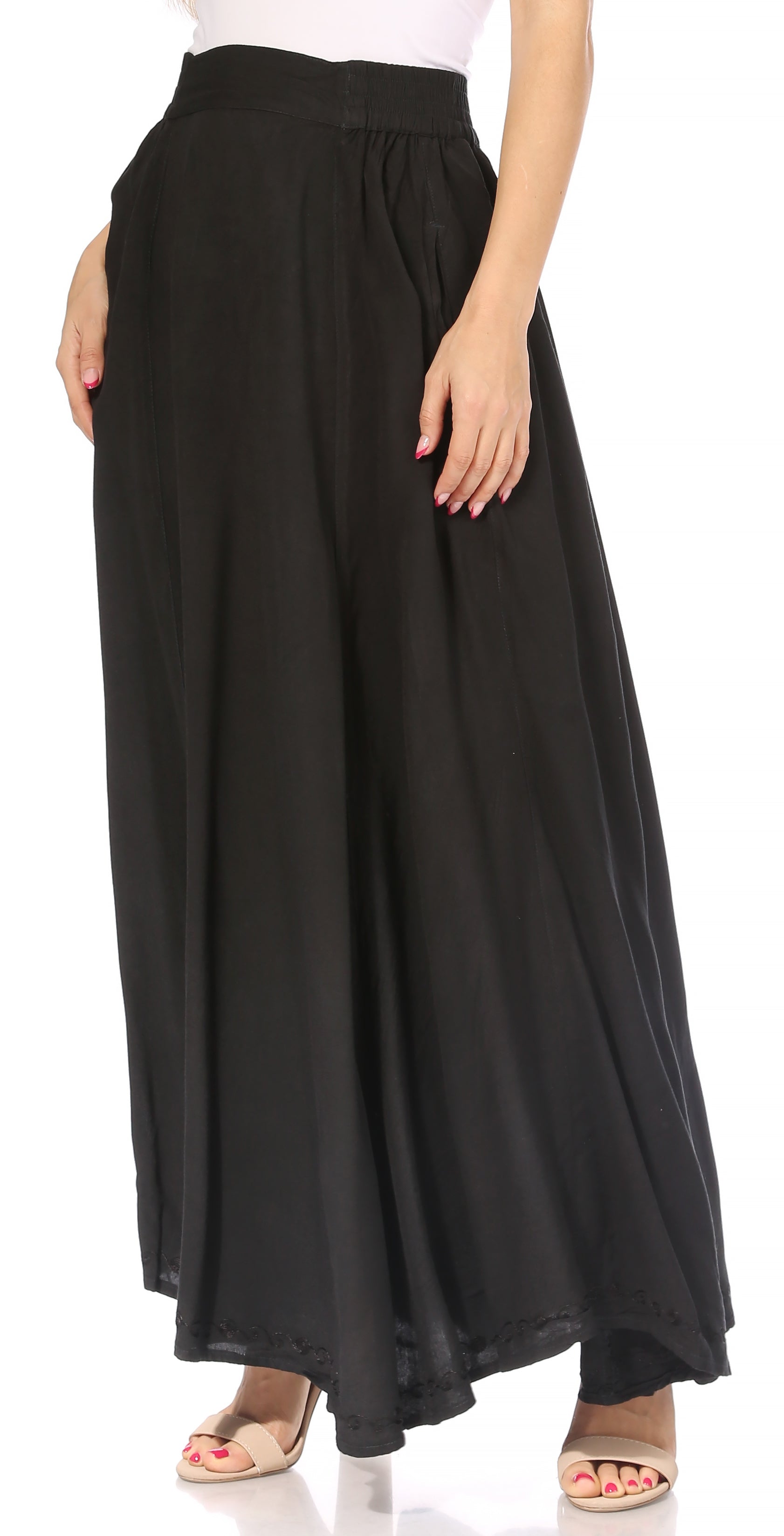 Black maxi skirt worn by a person on a white background
