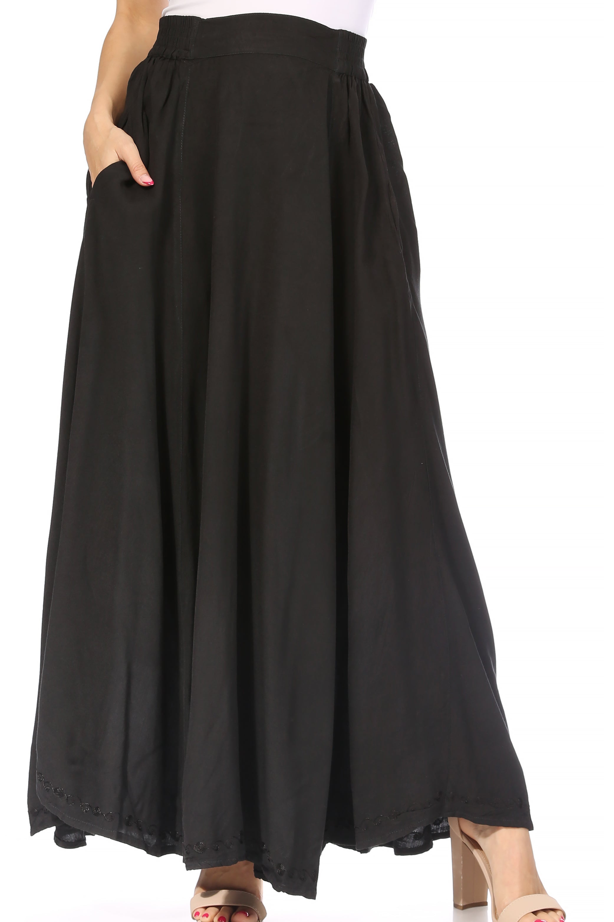 Black wide-leg pants worn by a person on a white background