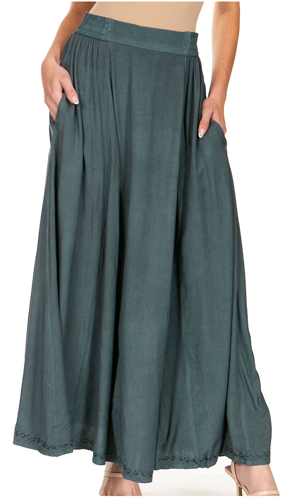 Green skirt worn by a person on a white background
