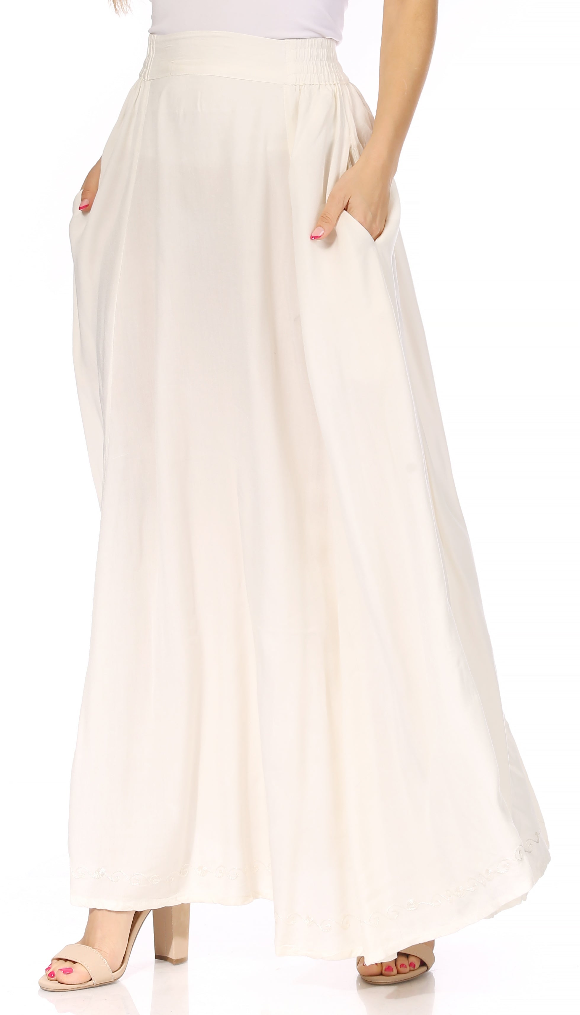 White wide-leg pants worn by a person on a white background