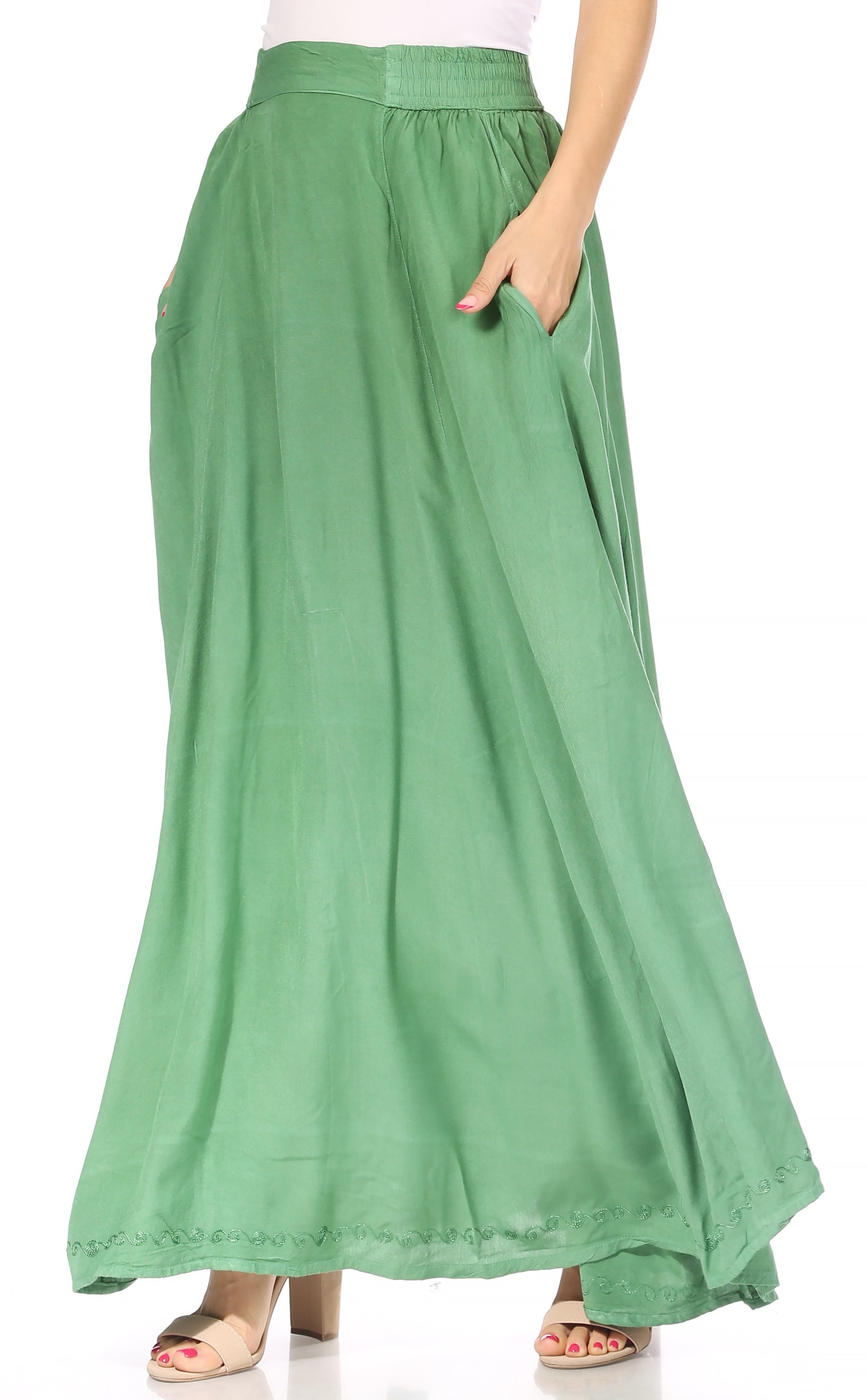 Green skirt worn by a person on a white background