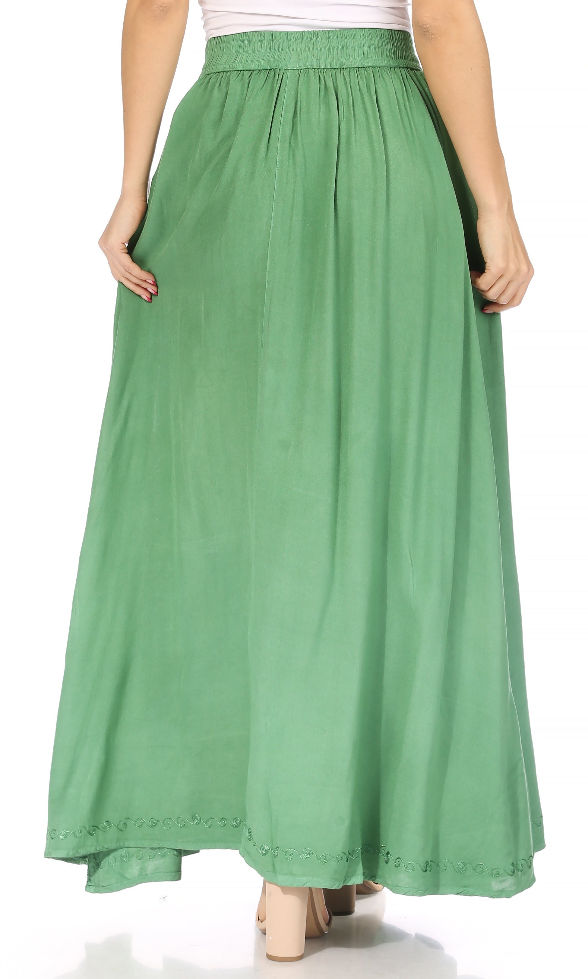 Green long skirt worn by a person on a white background