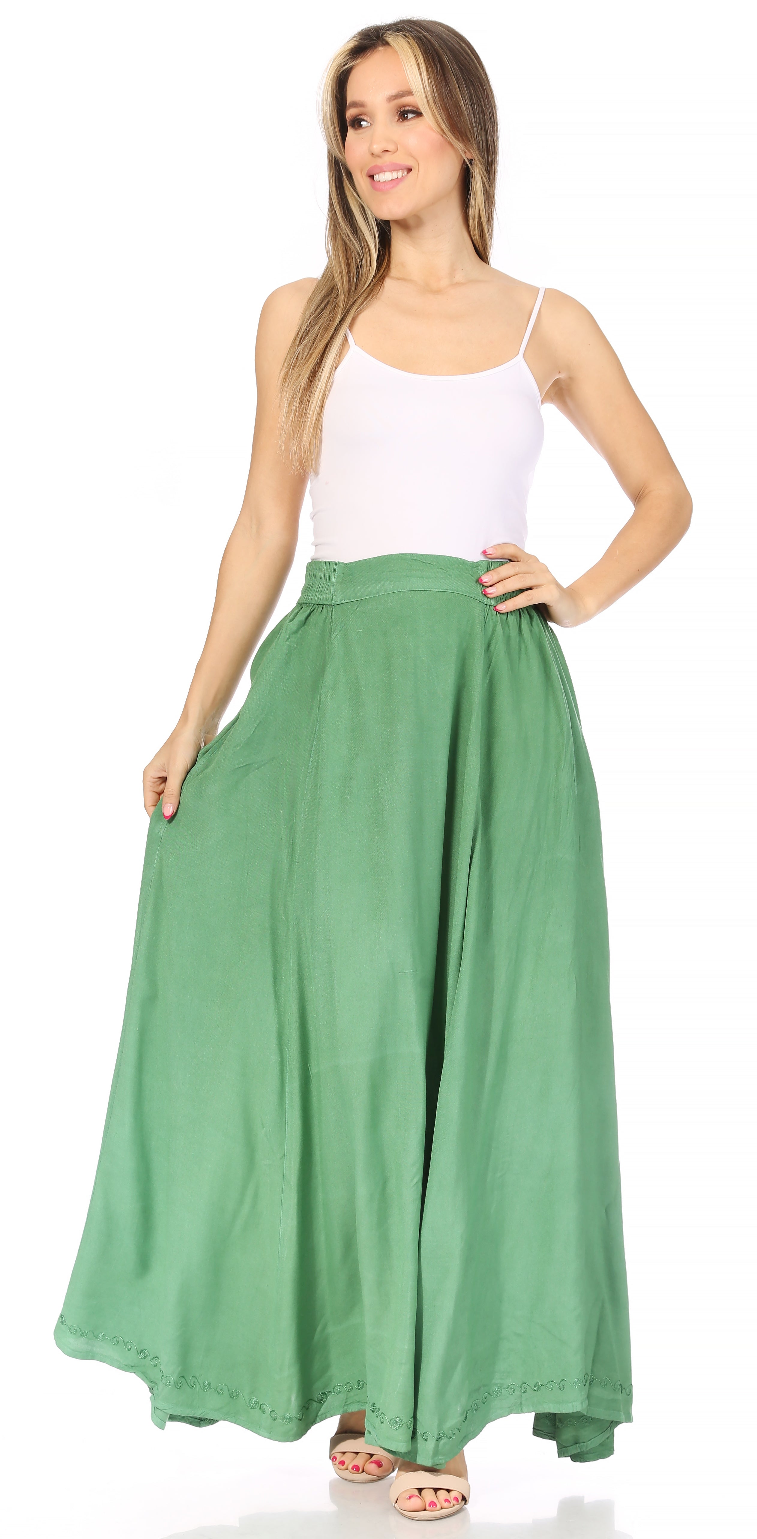 Woman wearing a white top and green long skirt on a white background