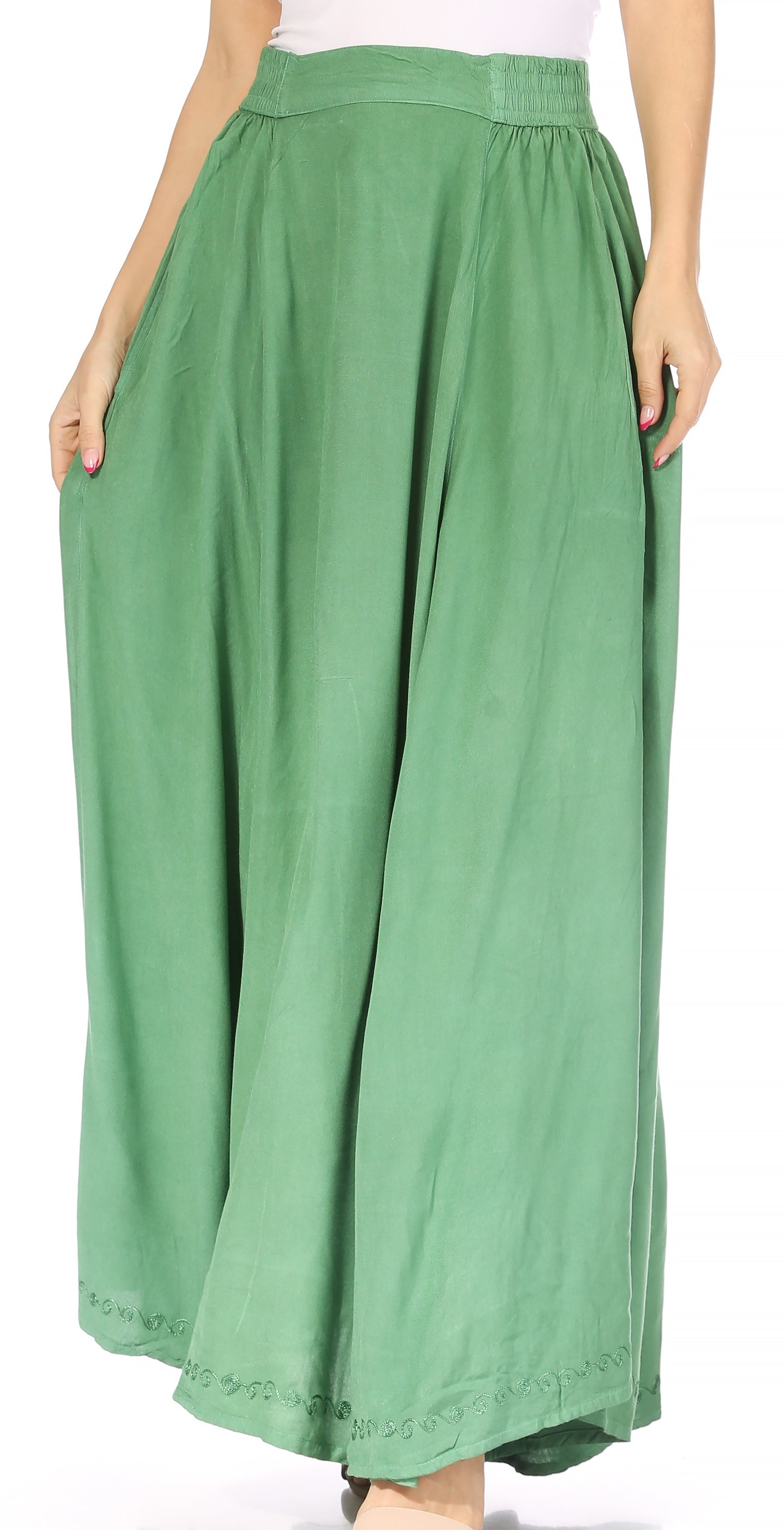 Green wide-leg pants worn by a person on a white background