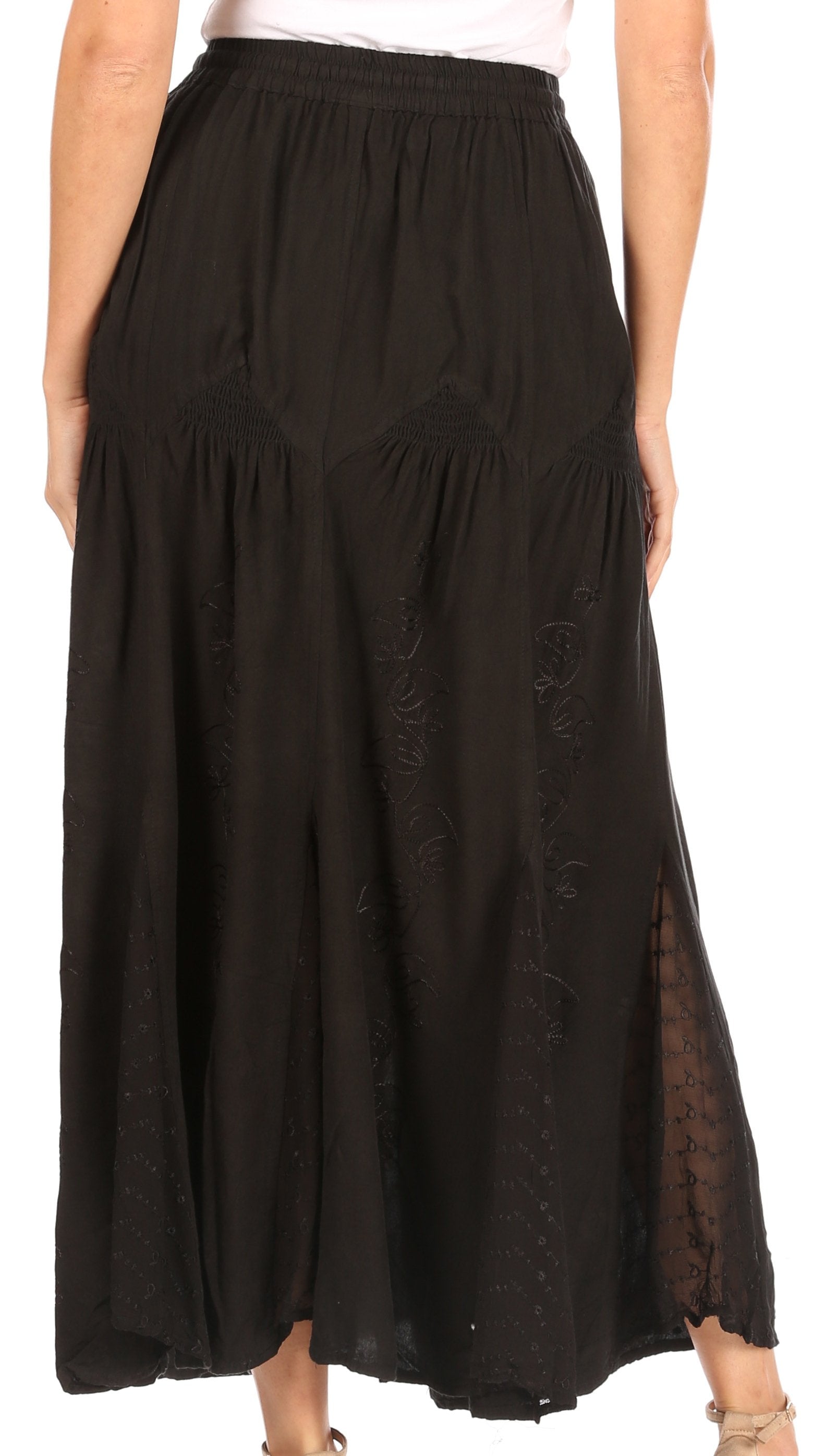Black long skirt worn by a person on a white background