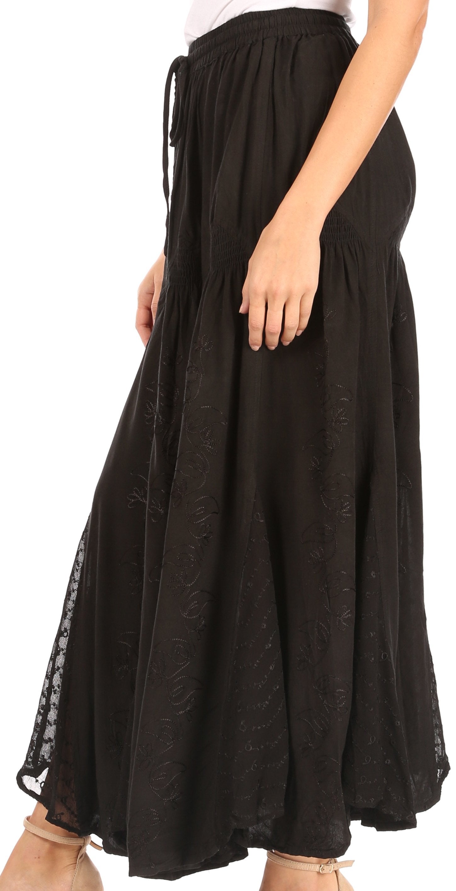 Black skirt with sheer overlay on a white background