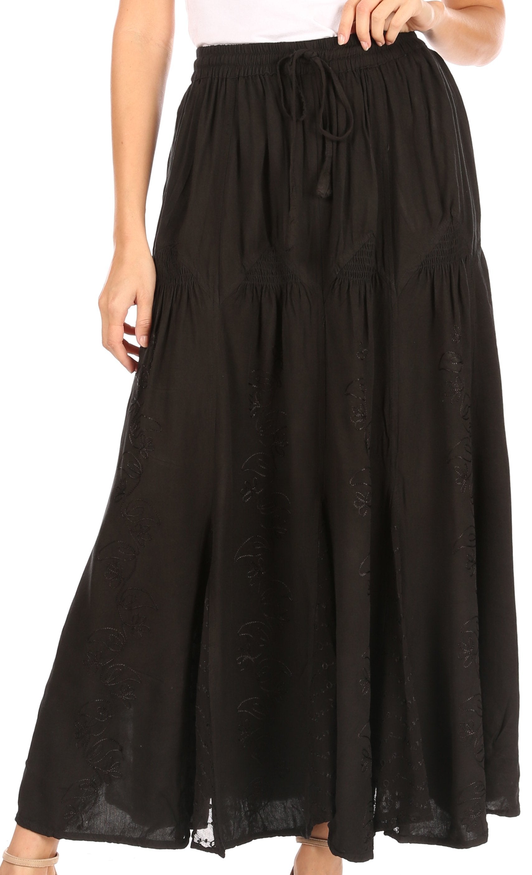 Black skirt worn by a person on a white background