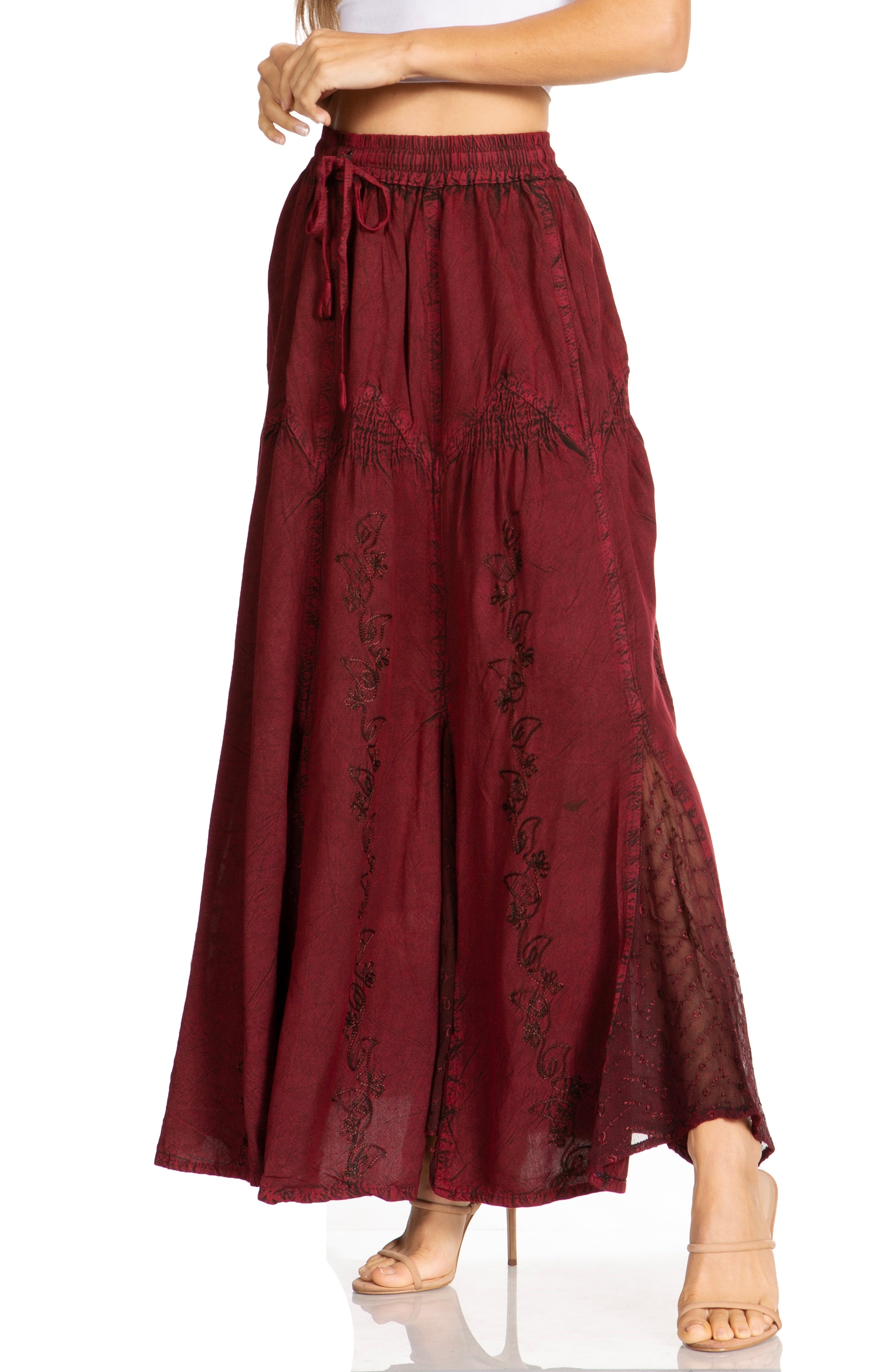 Maroon lace skirt worn by a person on a white background