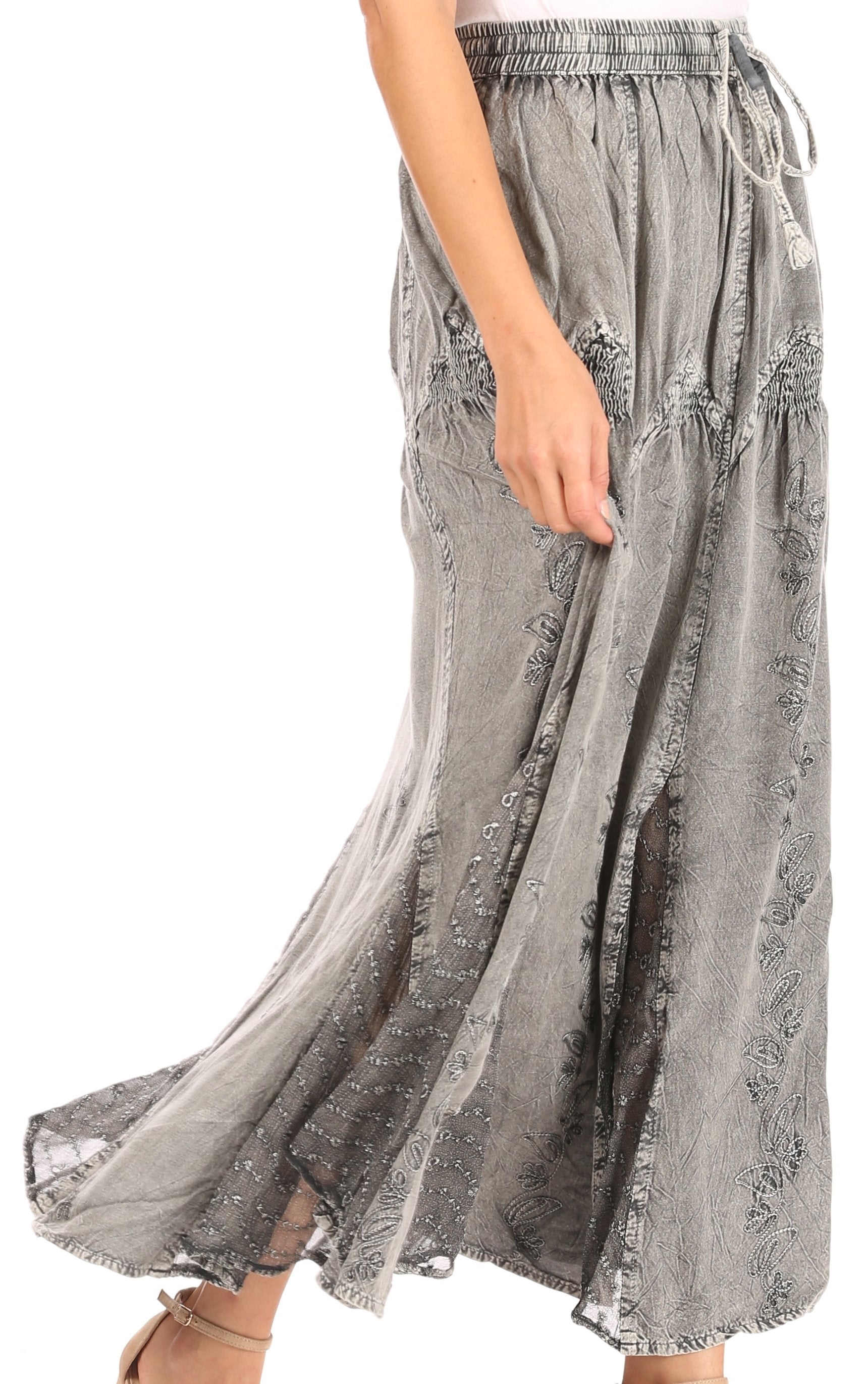 Gray lace skirt worn by a person on a white background