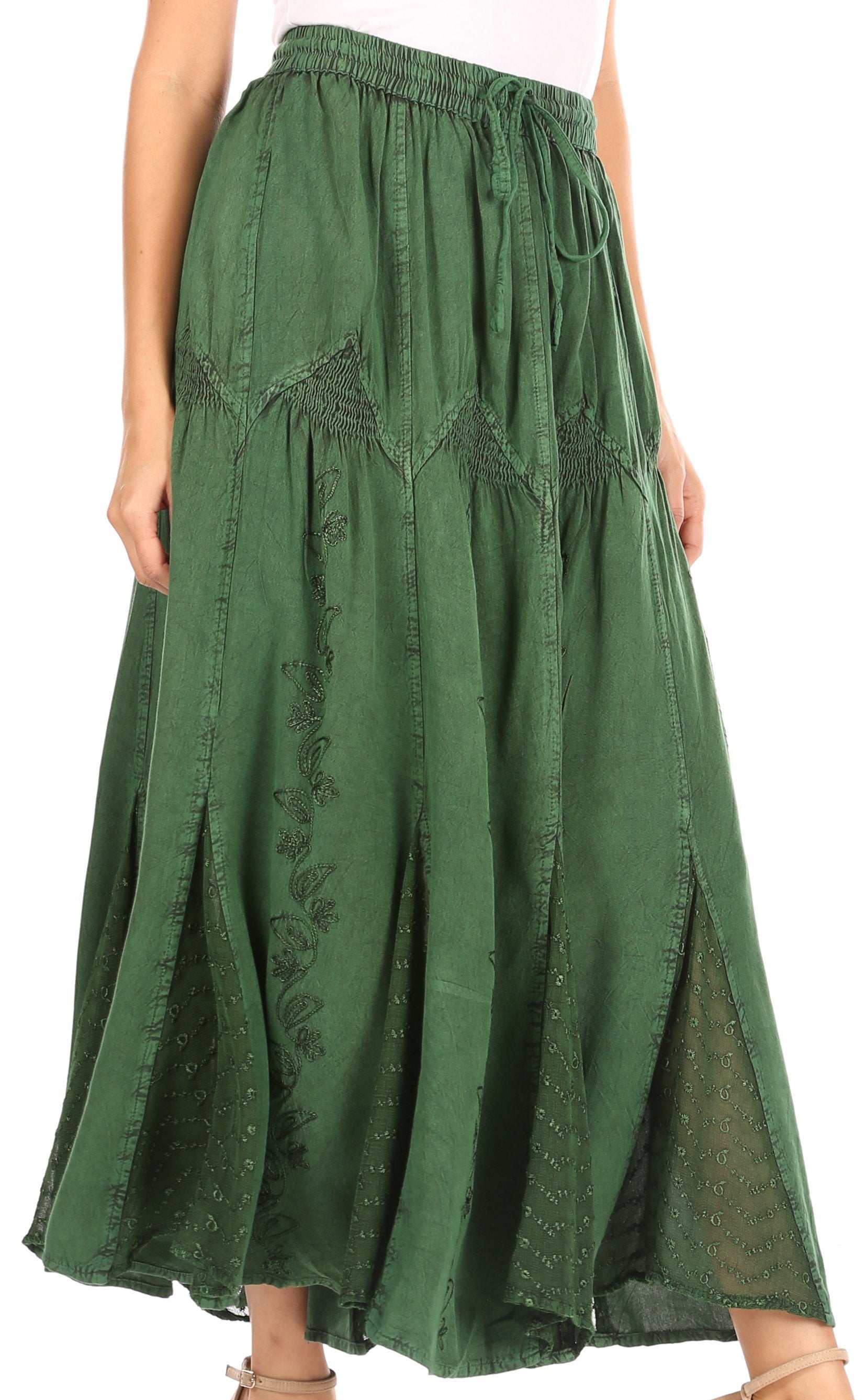 Green skirt with embroidery details on a white background