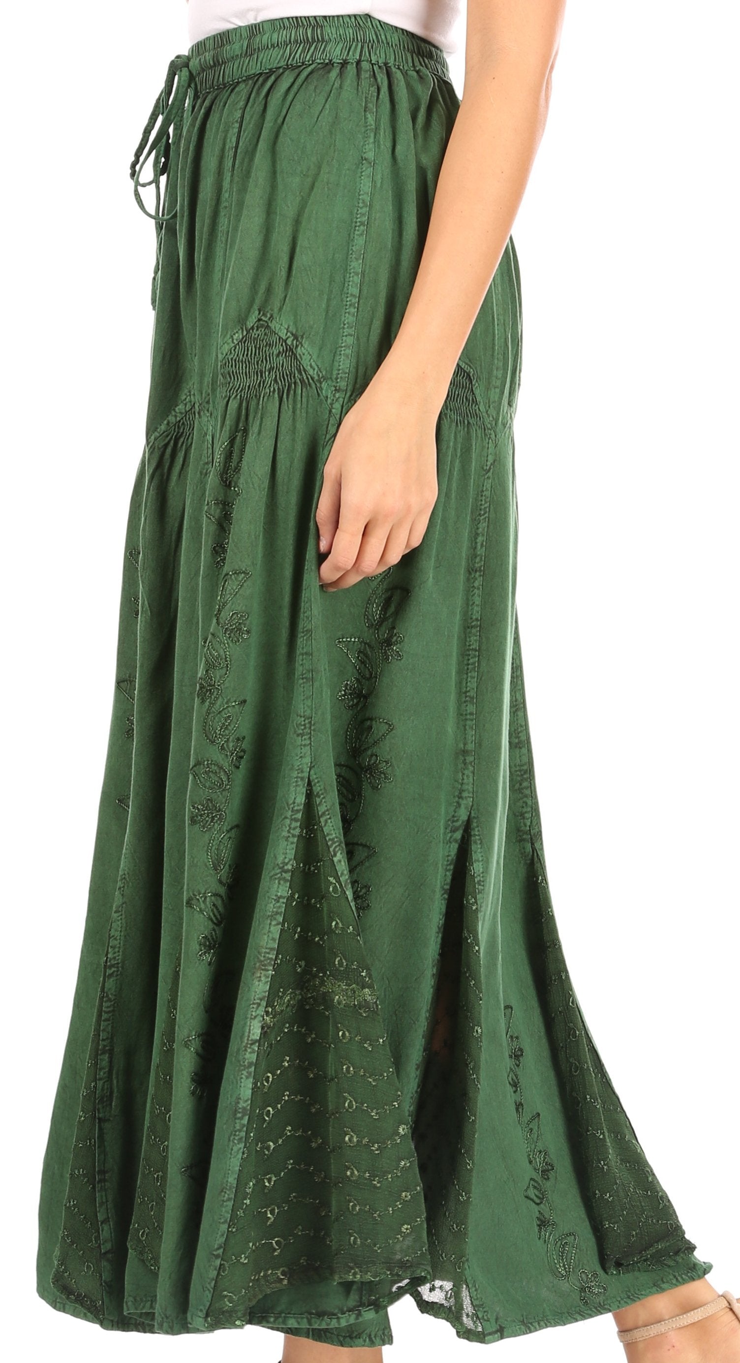 Green skirt with embroidery on a white background
