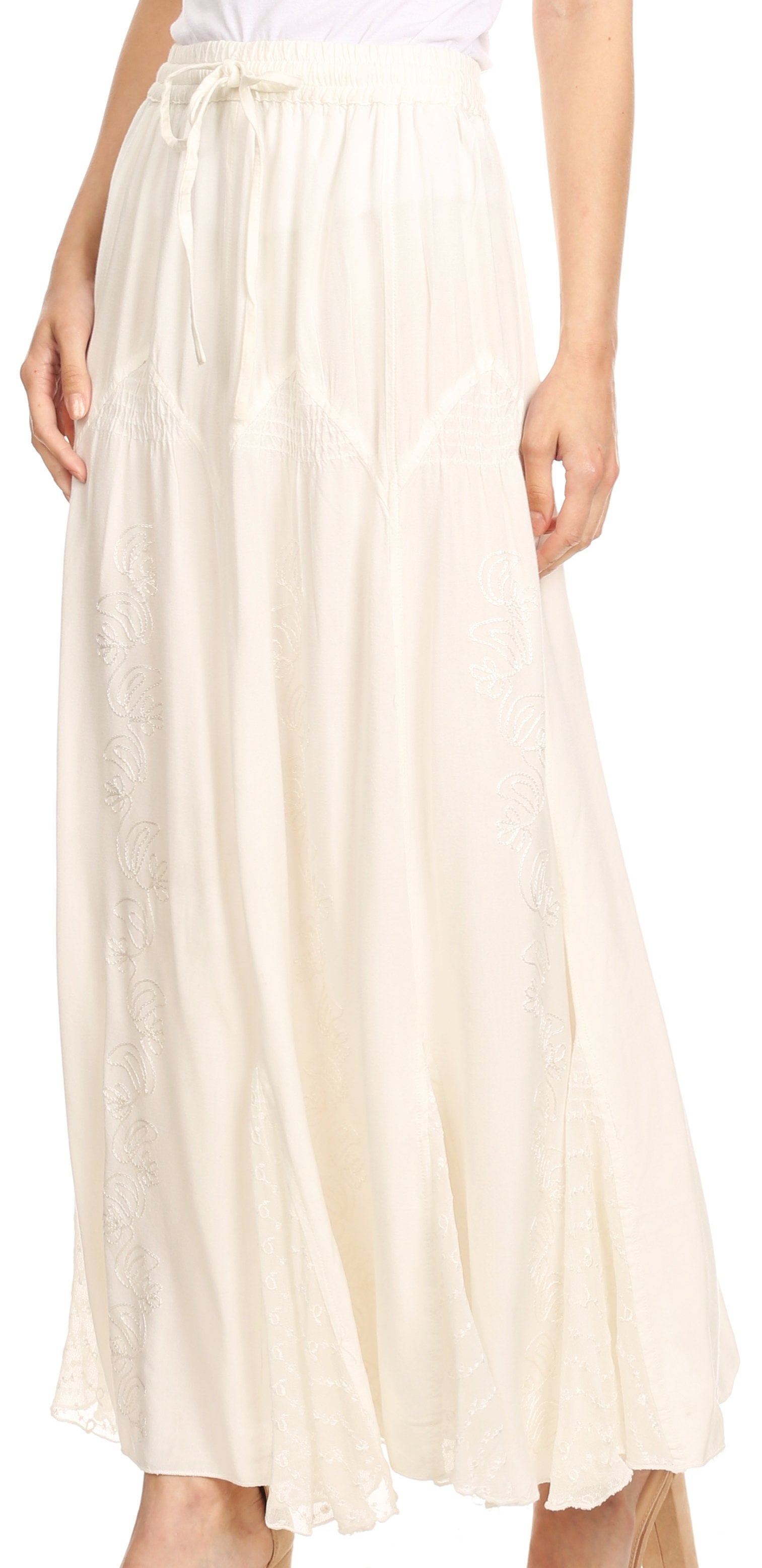 Long beige skirt worn by a person on a white background