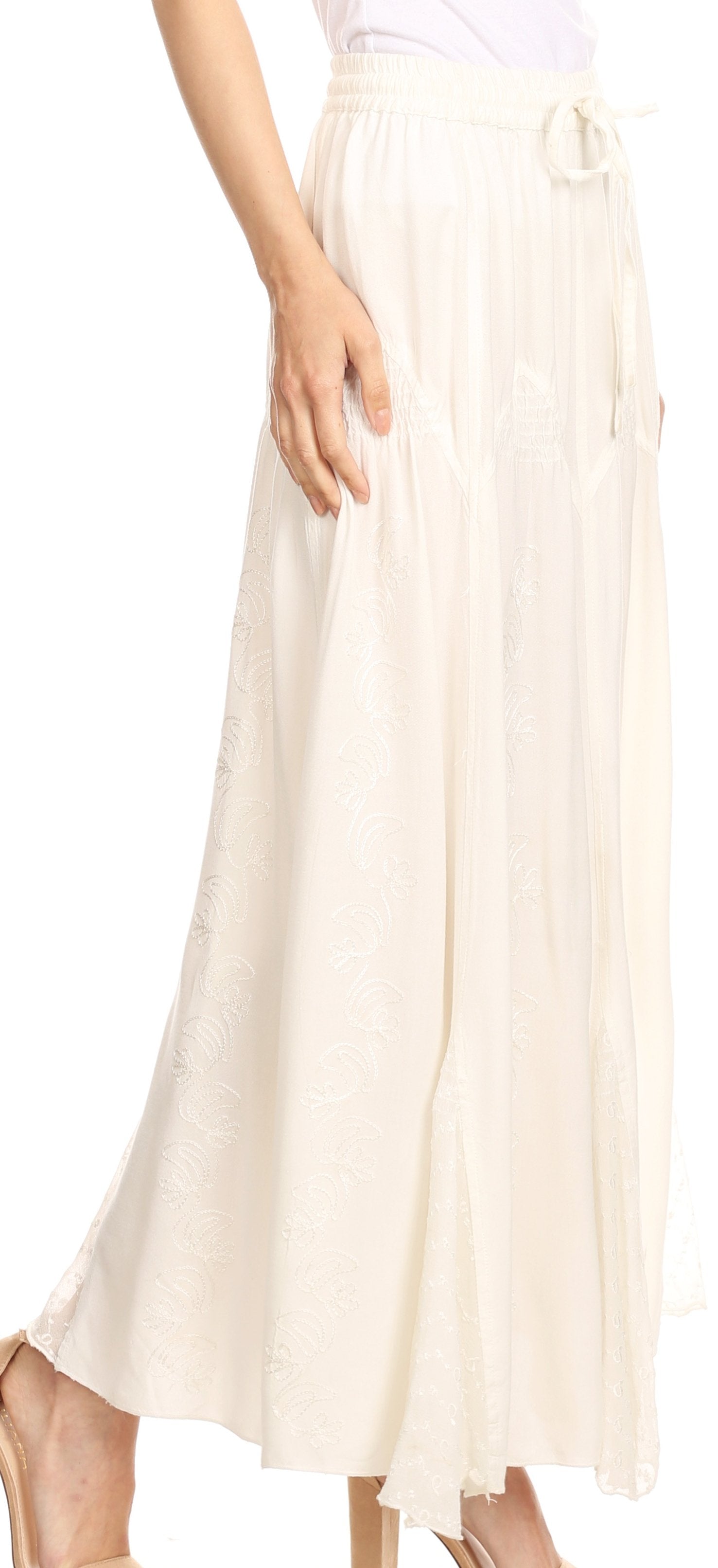 White pleated skirt worn by a person on a white background