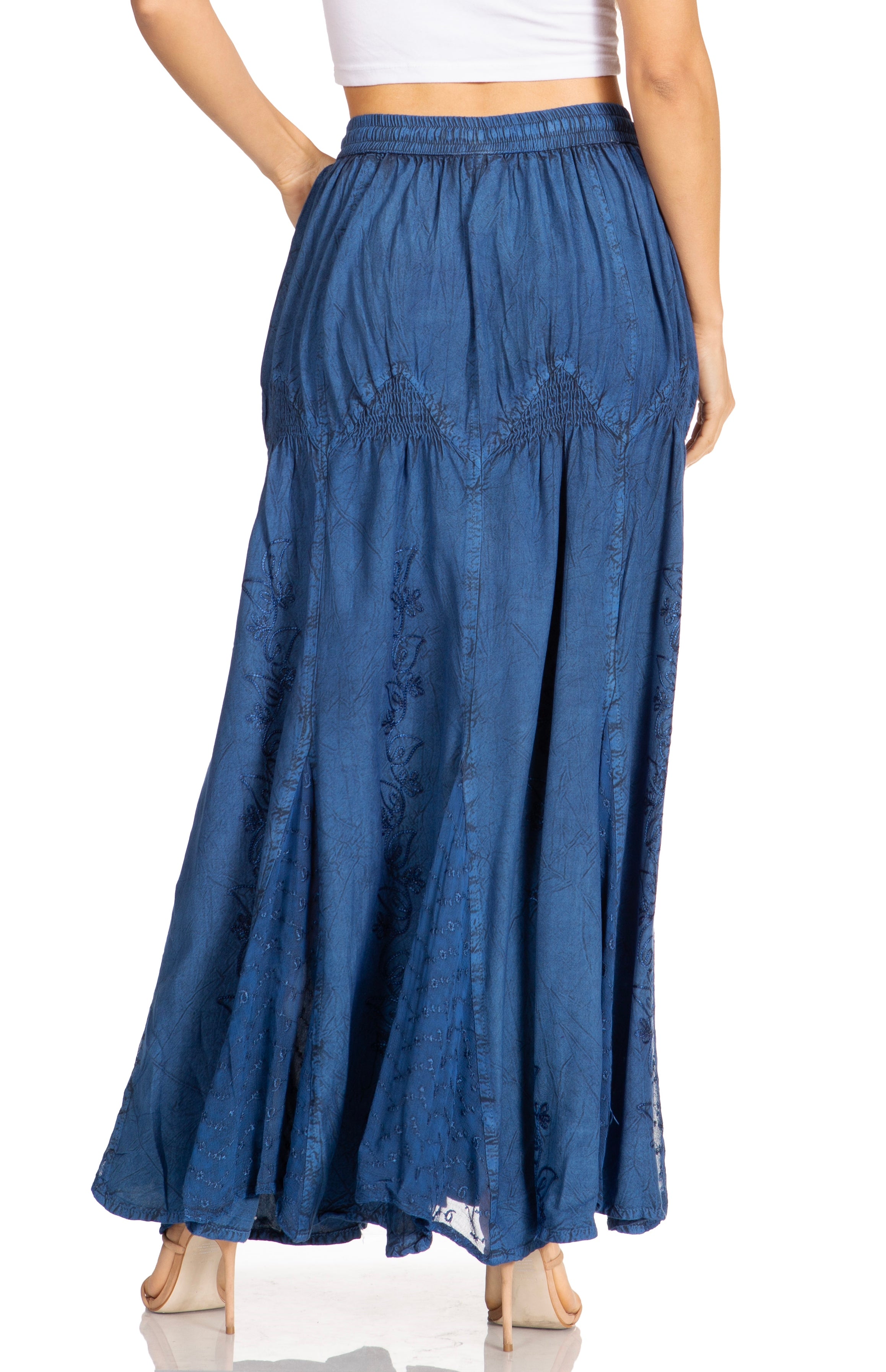 Blue denim skirt worn by a person on a white background