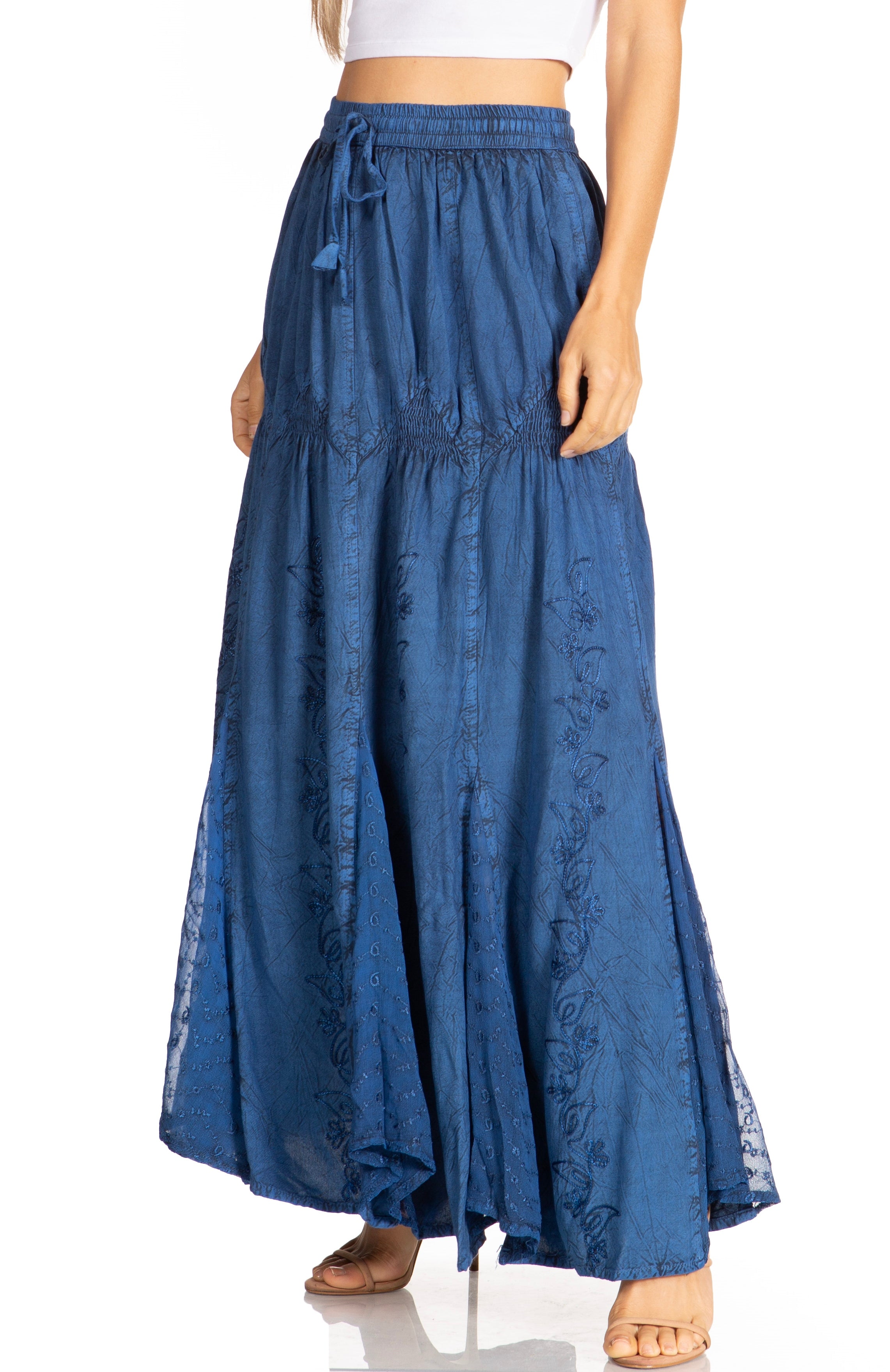 Blue denim skirt worn by a person on a white background