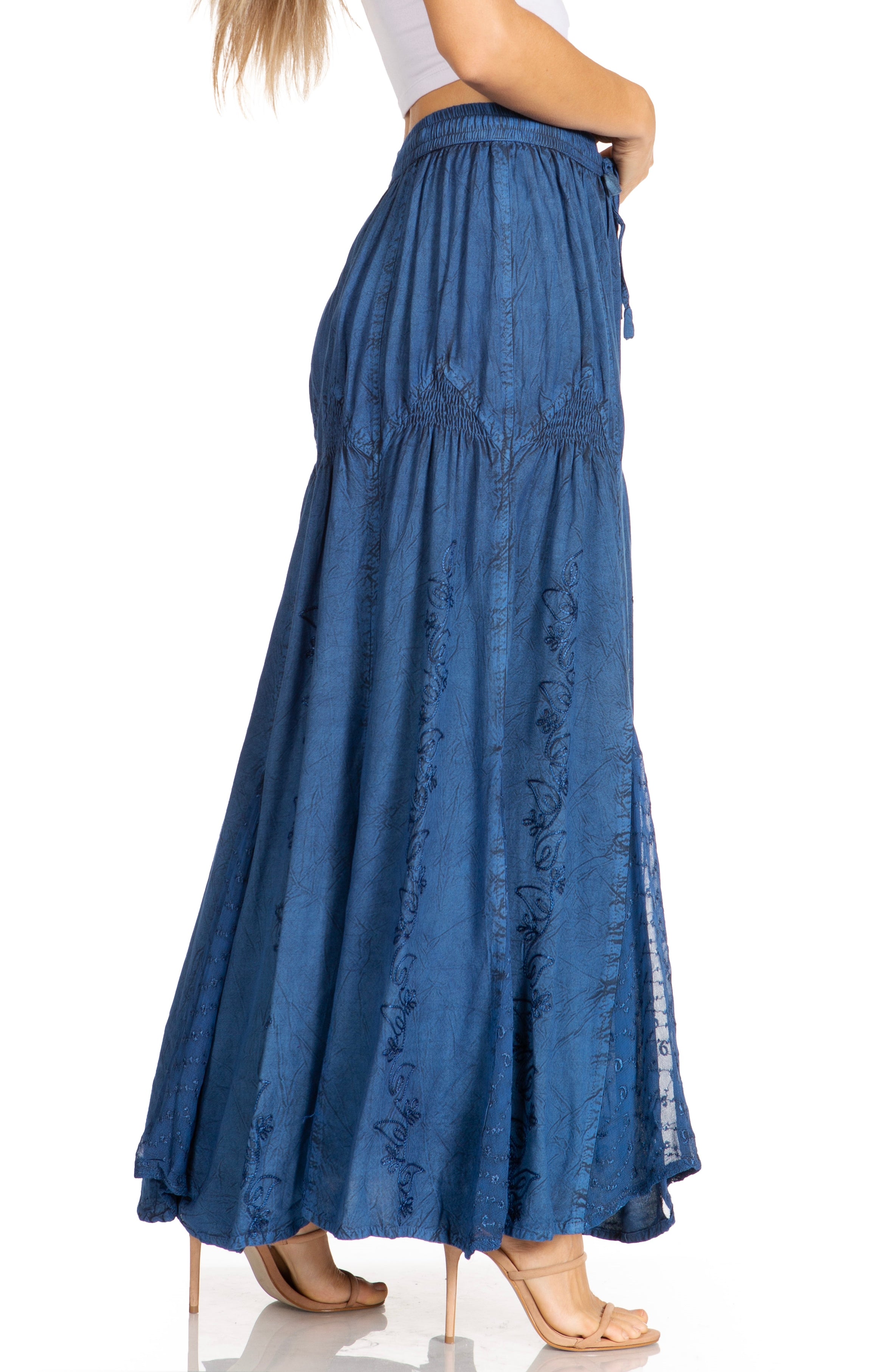 Blue denim skirt worn by a person on a white background