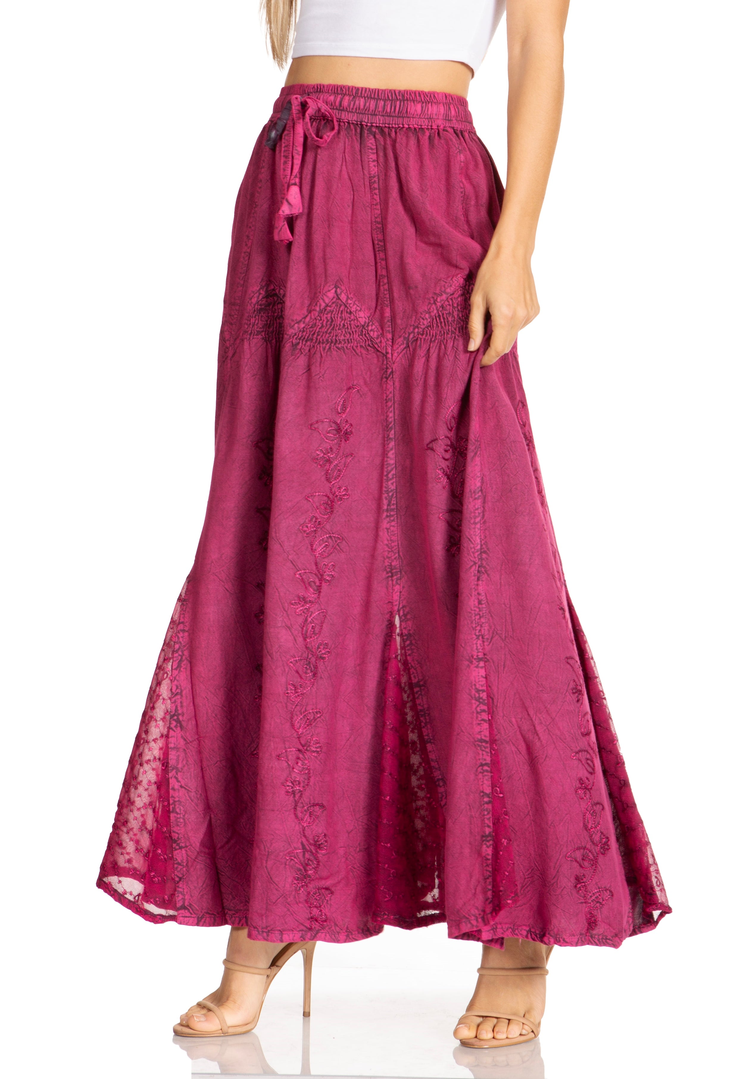 Long pink skirt with floral patterns on a white background