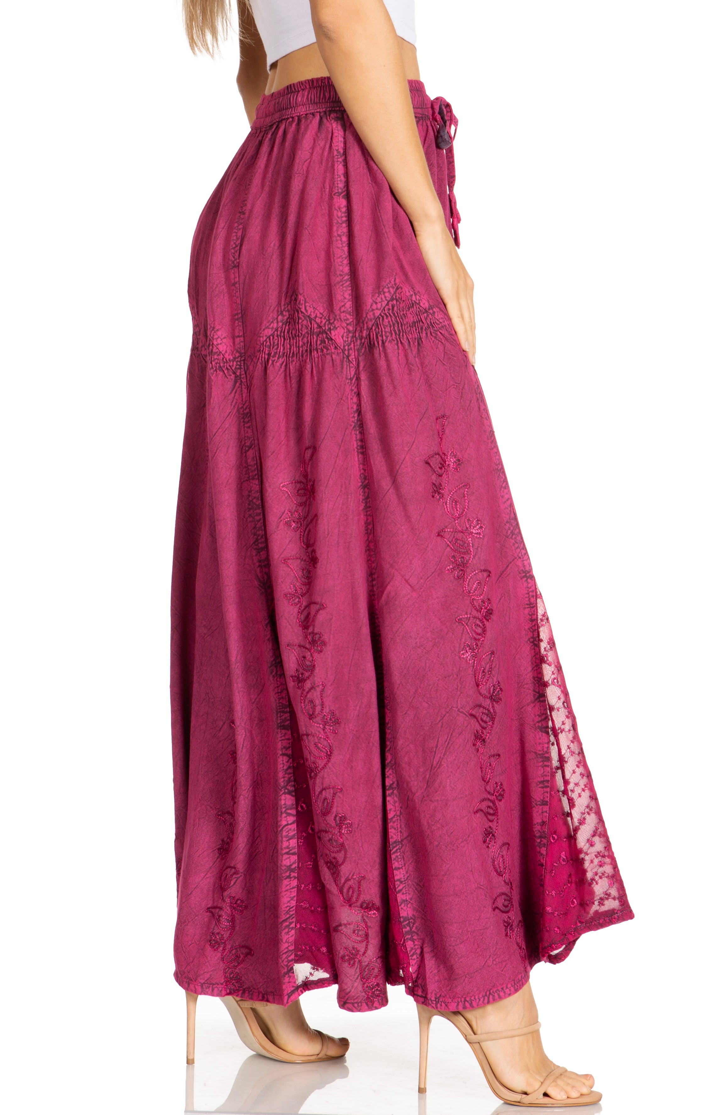 Magenta wide-leg pants with lace details on a white background