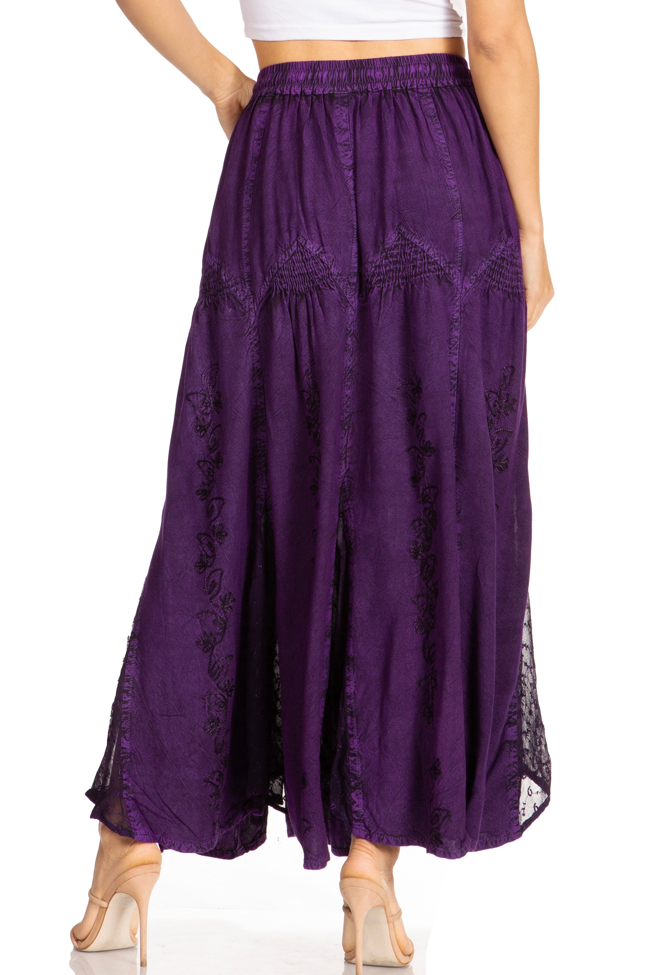 Purple skirt with lace details worn by a person on a white background