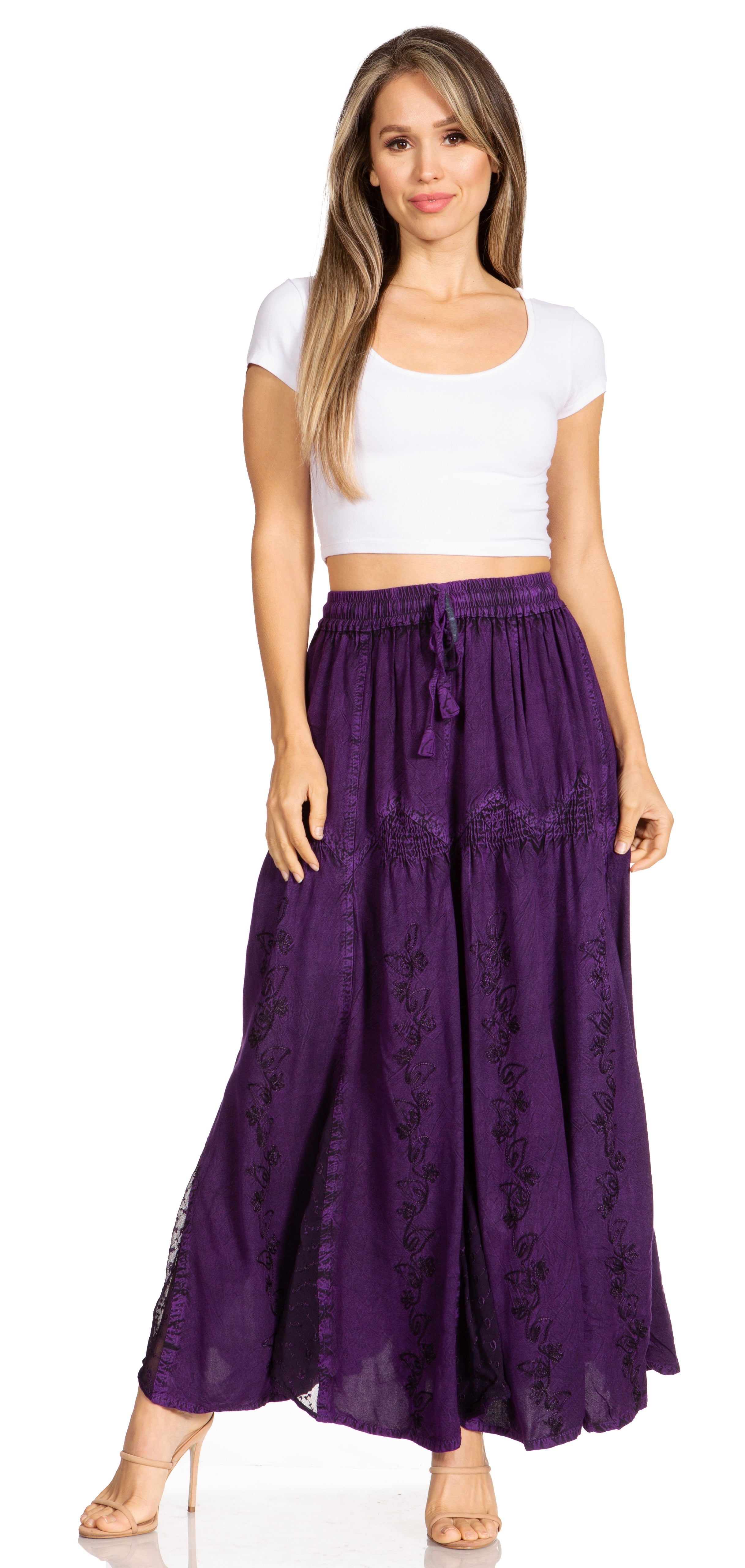 Woman wearing a white top and purple skirt on a white background