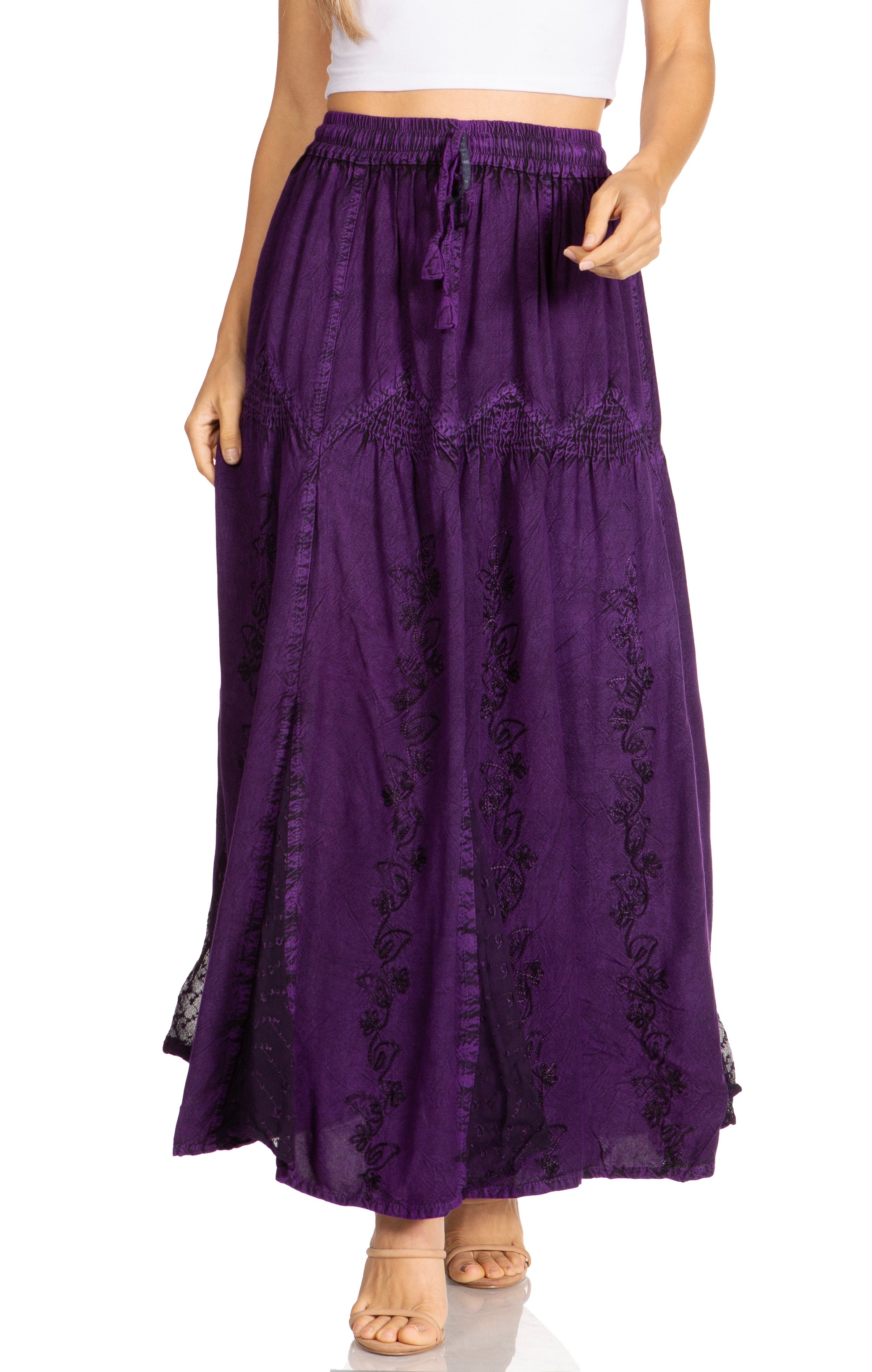 Purple lace-trimmed skirt worn by a person on a white background