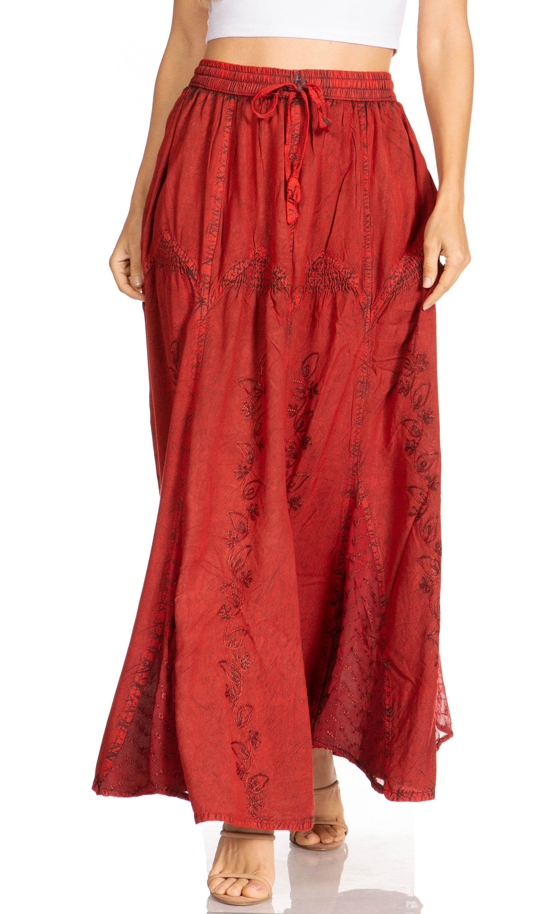 Red patterned skirt worn by a person on a white background