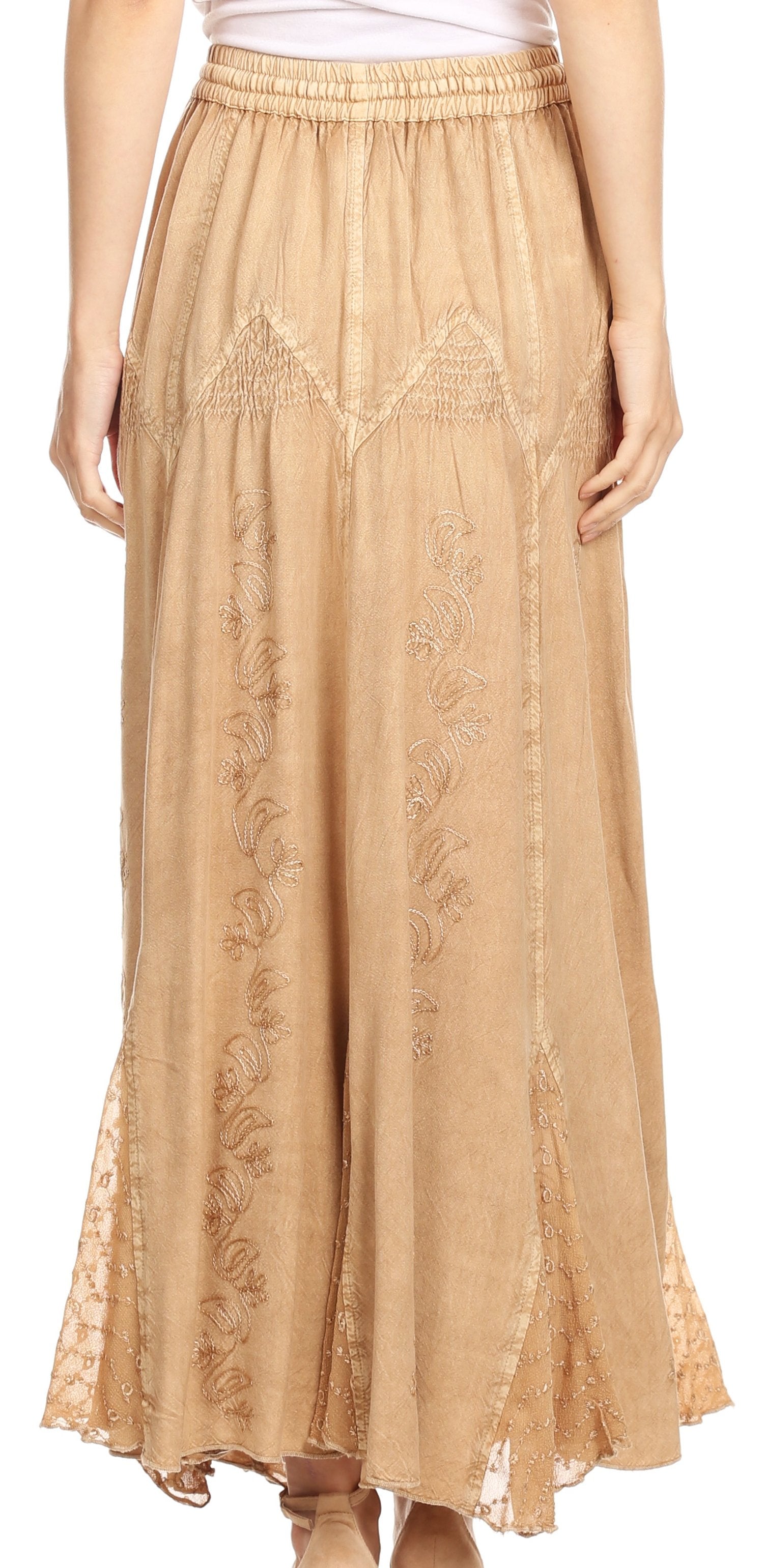 Beige lace skirt worn by a person on a white background
