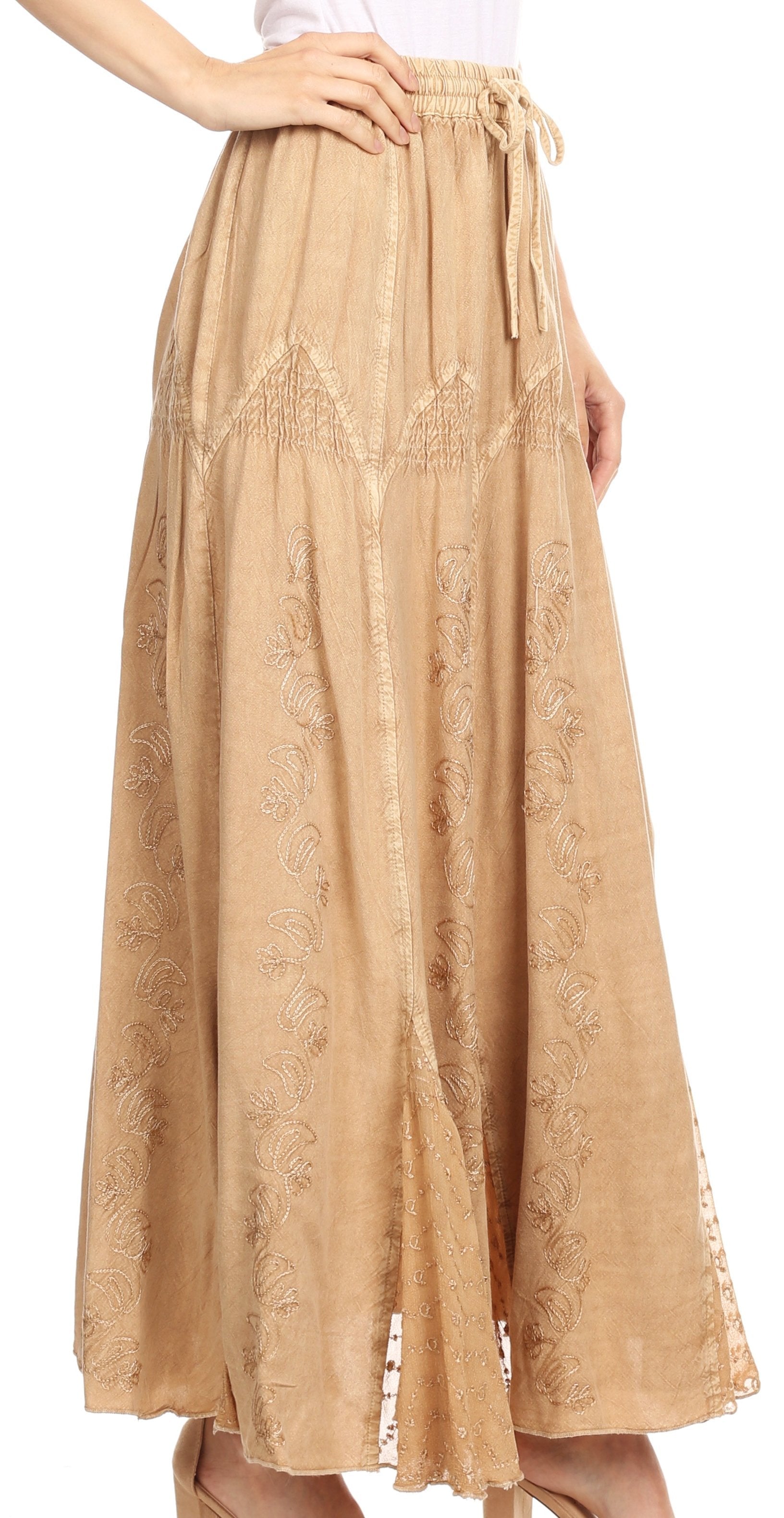 Beige lace skirt worn by a person on a white background