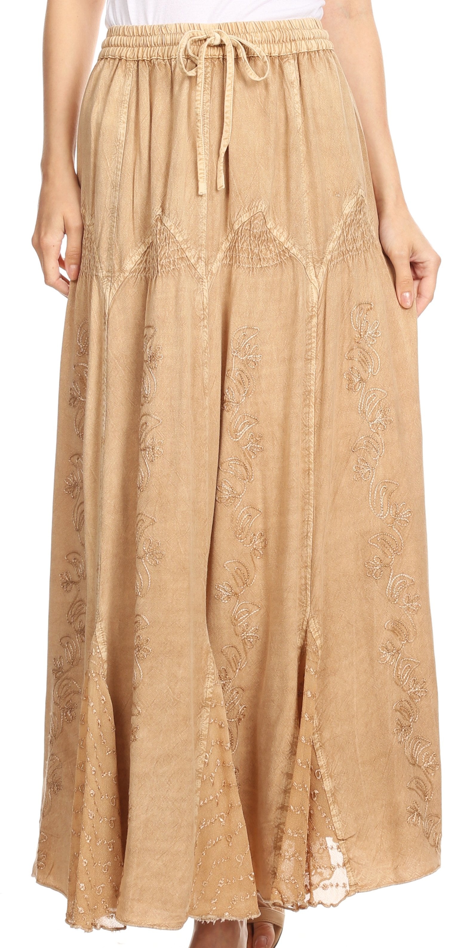 Beige lace skirt worn by a person on a white background