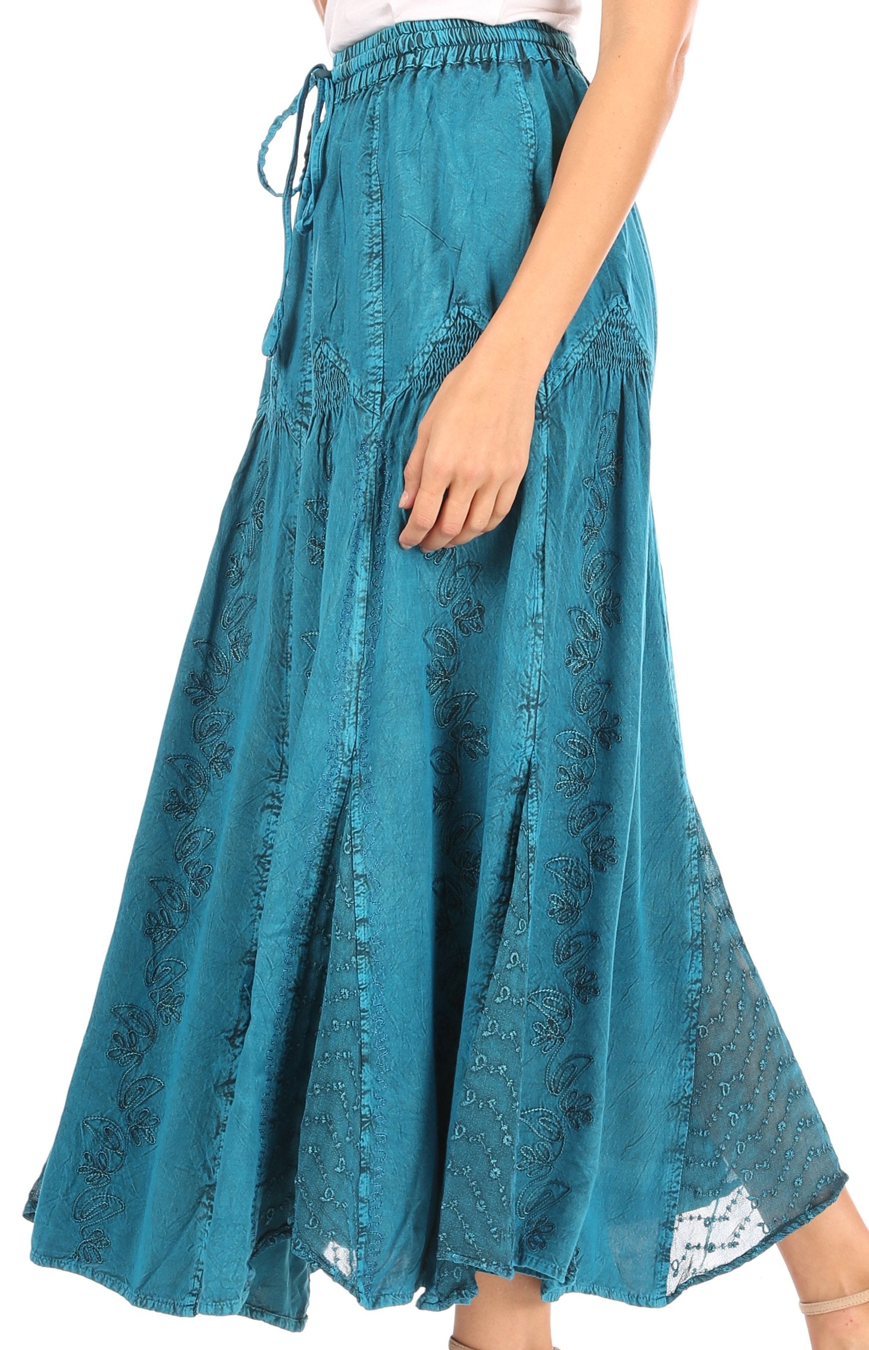 Teal denim skirt with lace trim on a white background