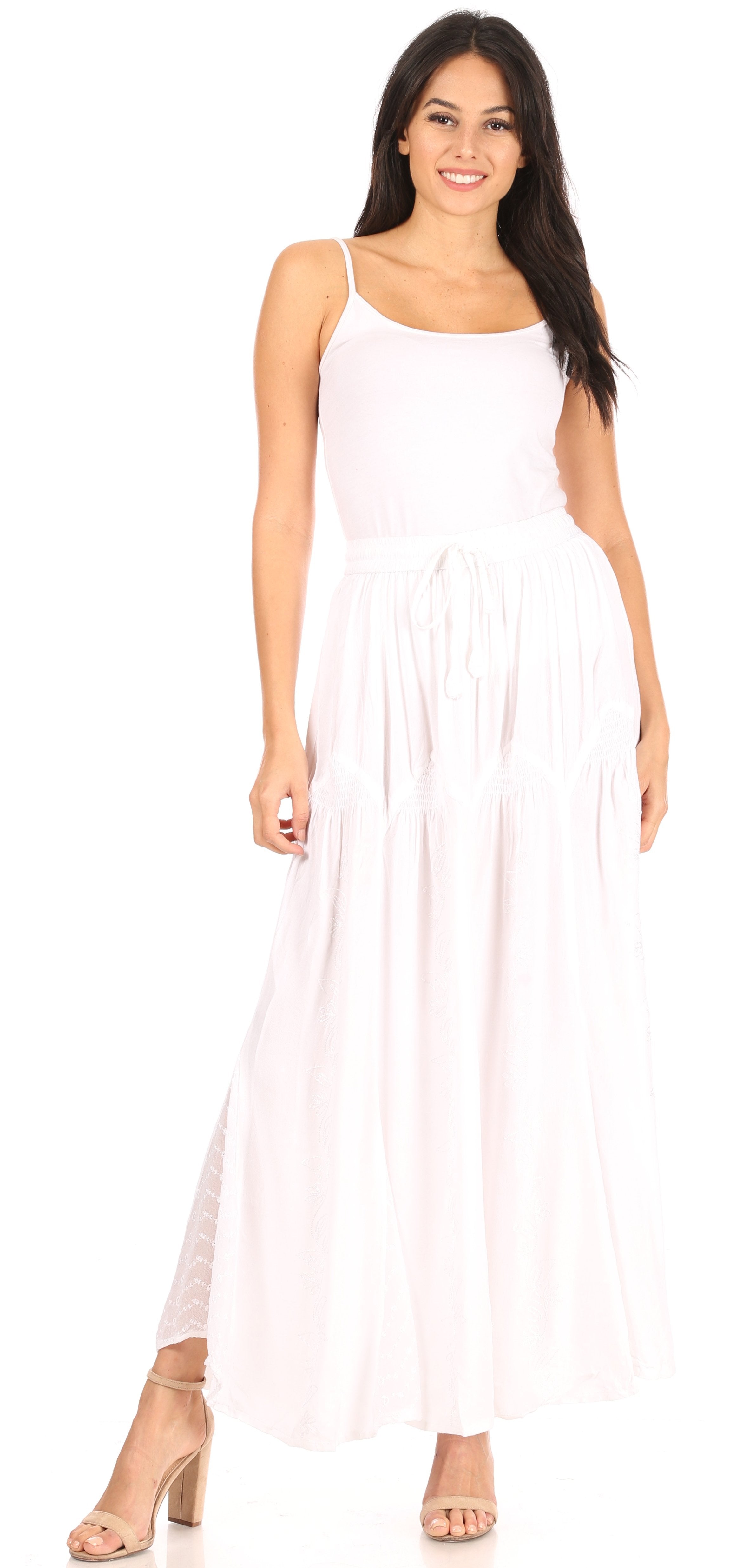 Woman wearing a white sleeveless dress on a white background