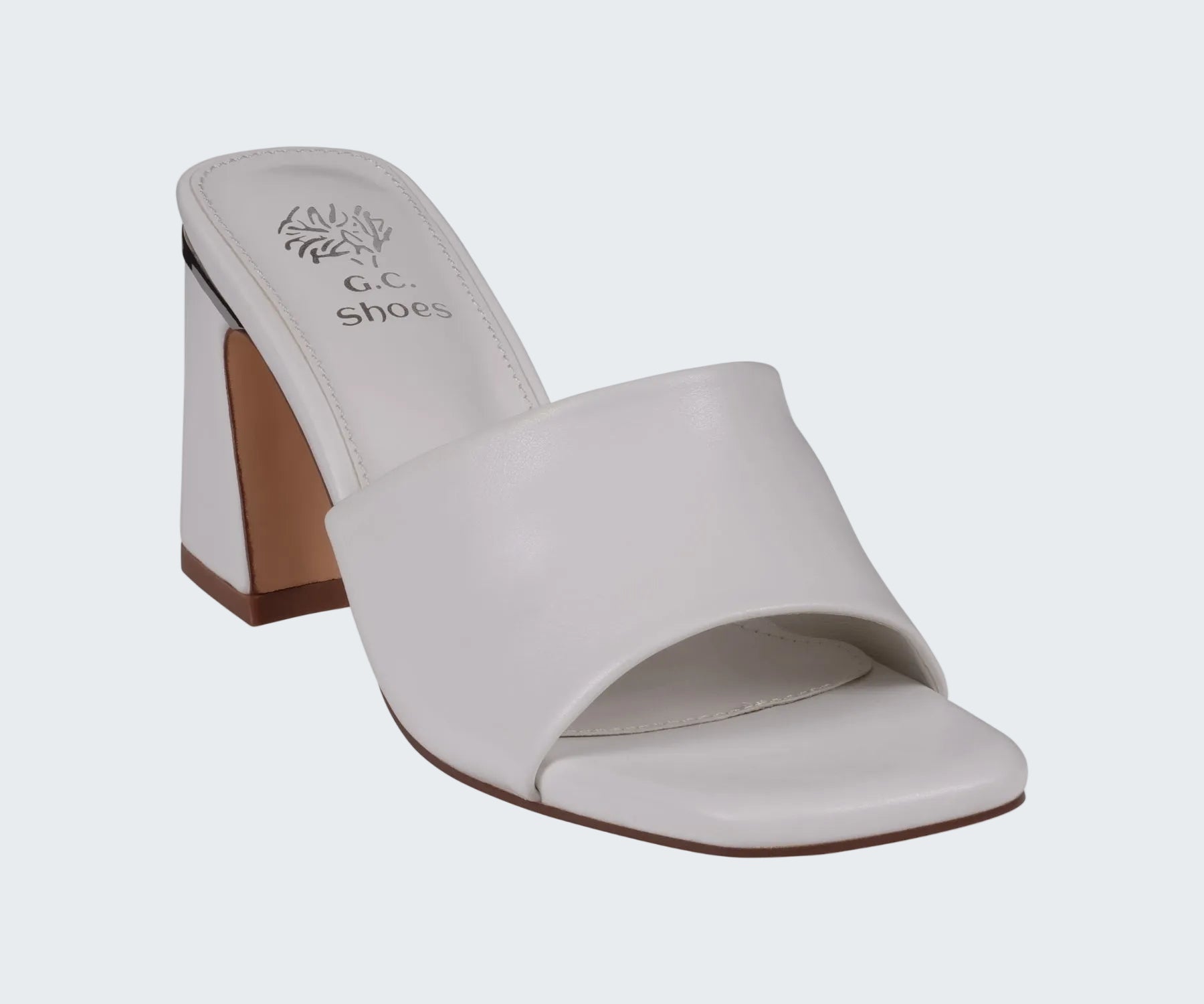 White sandal with a wooden heel on a white background