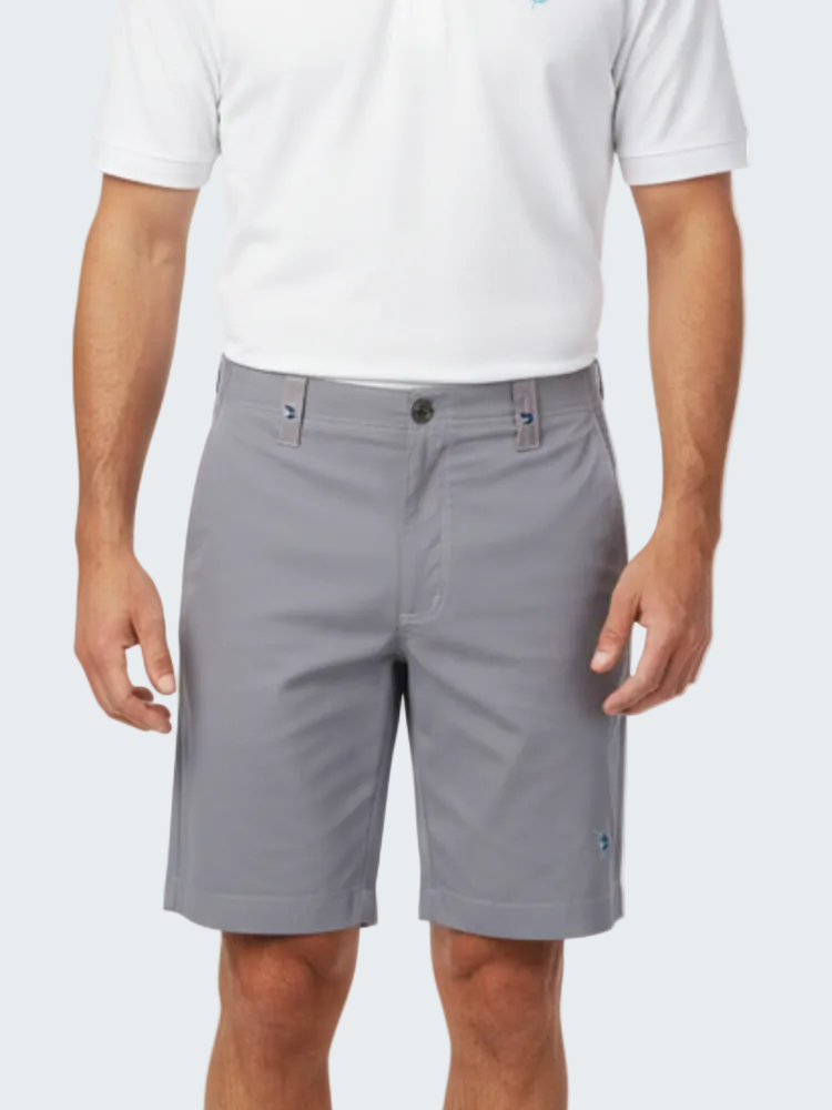 Person wearing gray shorts and a white shirt on a white background