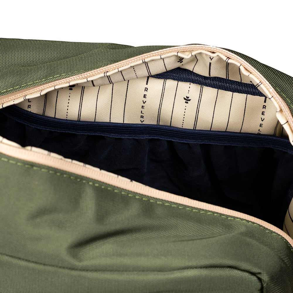 Green bag interior with striped lining and visible brand name